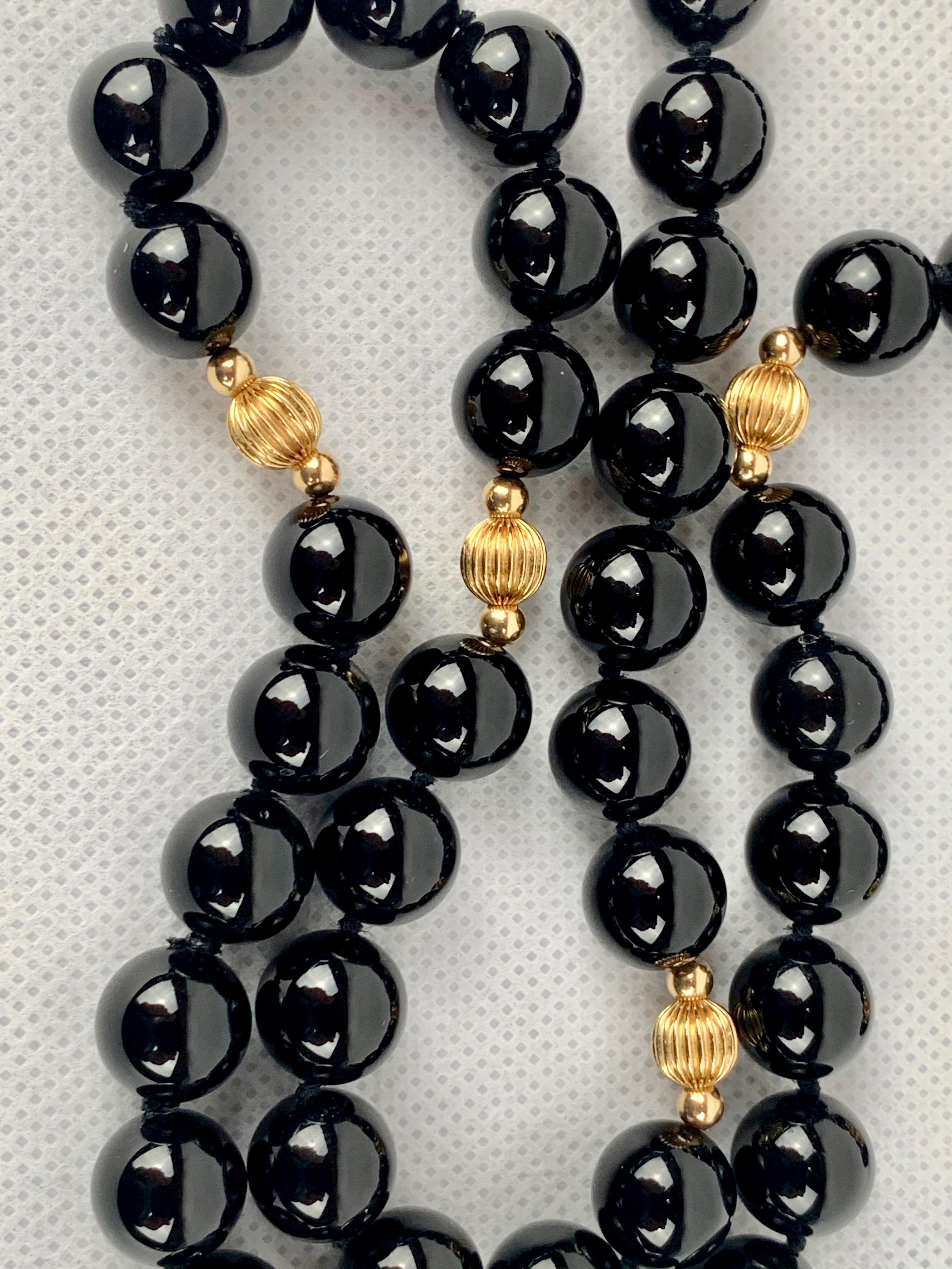 Strand of hand knotted black onyx beads 31