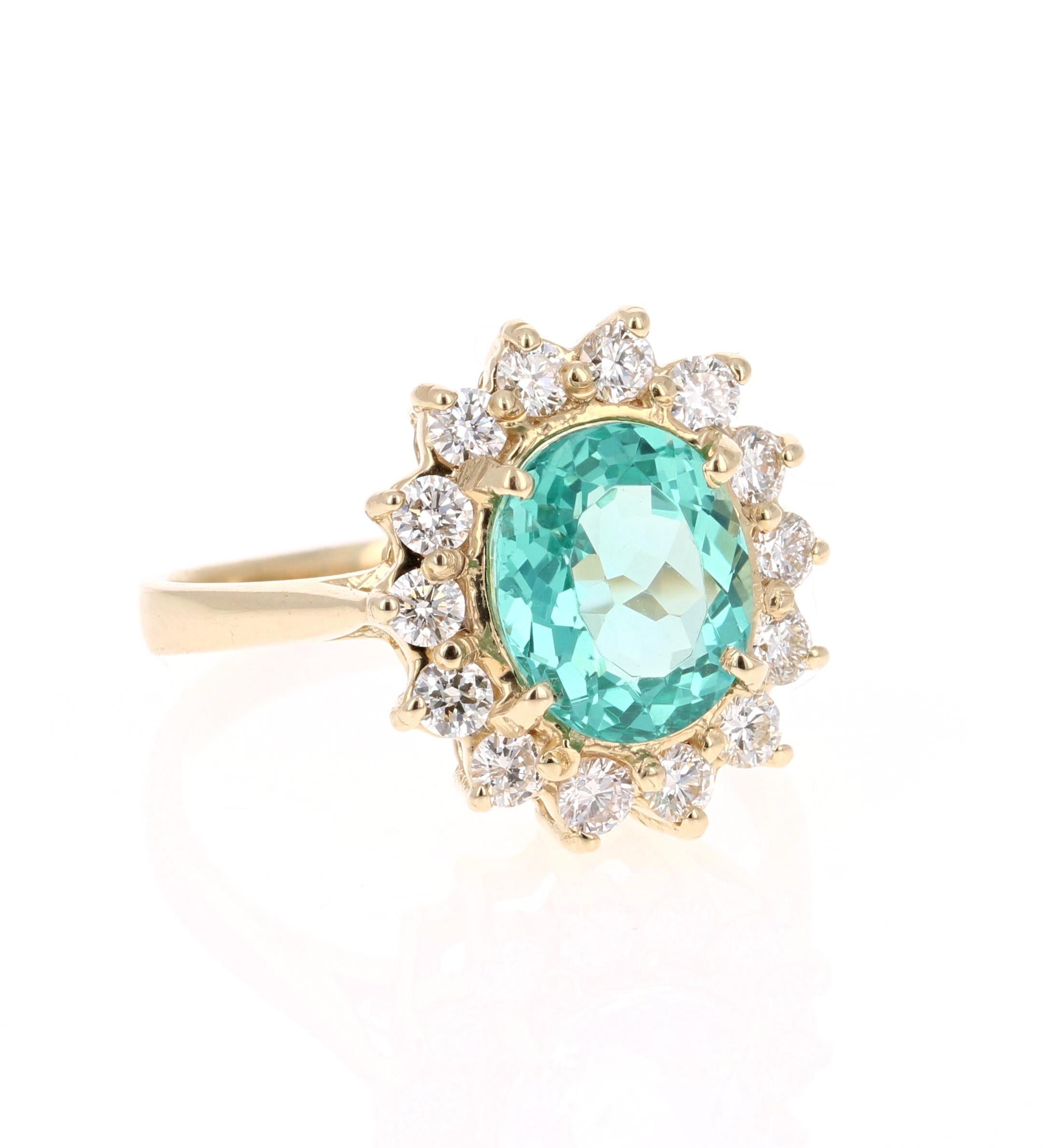 Classic and beautifully designed Apatite and Diamond Ring!  
This ring has a 2.48 carat Oval Cut Apatite in the center of the ring and is surrounded by 14 Round Cut Diamonds that weigh a total of 0.62 carats.   The Clarity and Color of the Diamonds