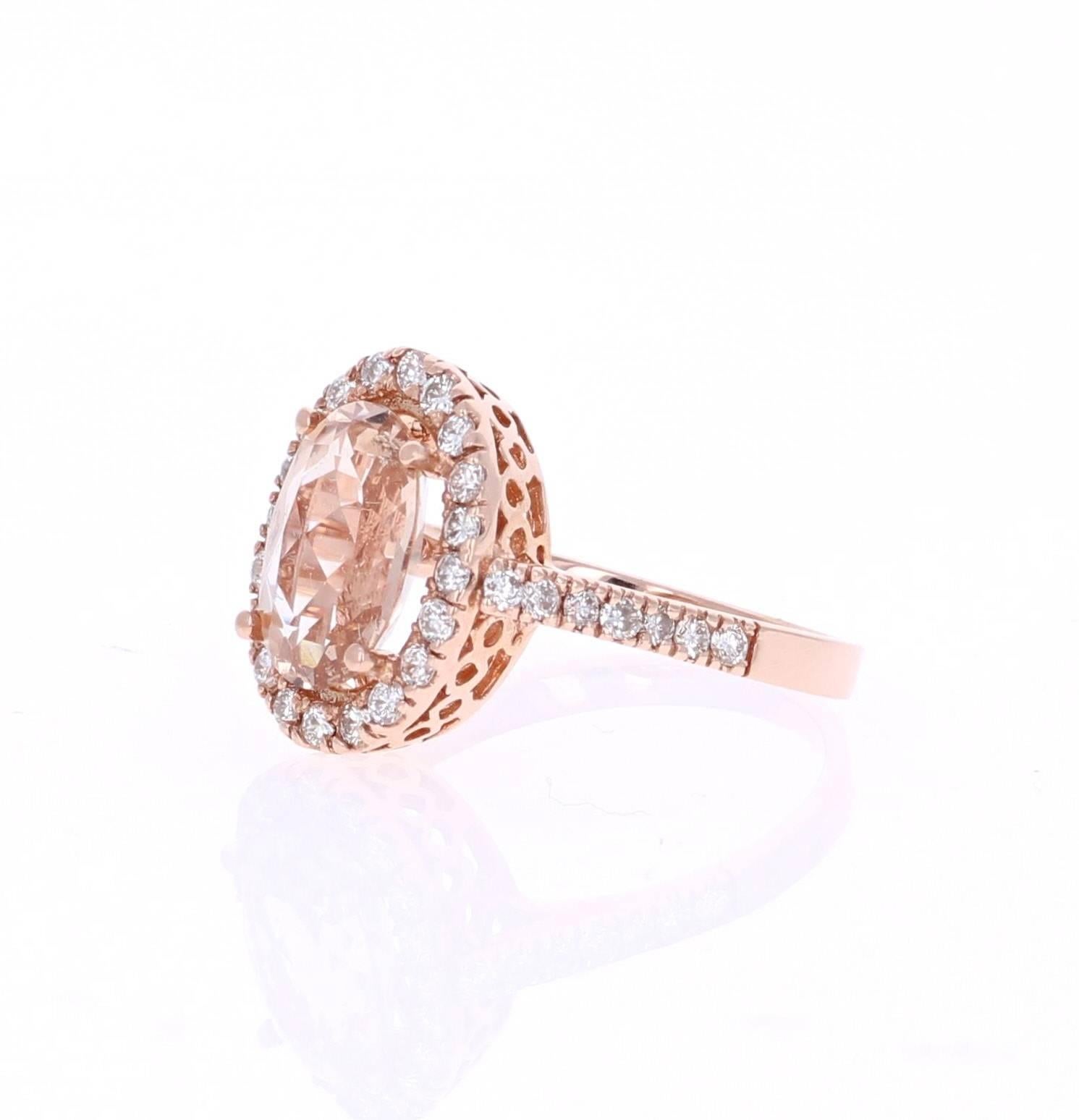 This classic Morganite Ring has a 2.45 Carat Oval Cut Morganite as its center and is surrounded by a halo of 34 Round Cut Diamonds that weigh 0.65 Carats. The clarity and color of the diamonds are VS-H.   The total carat weight of the ring is 3.10