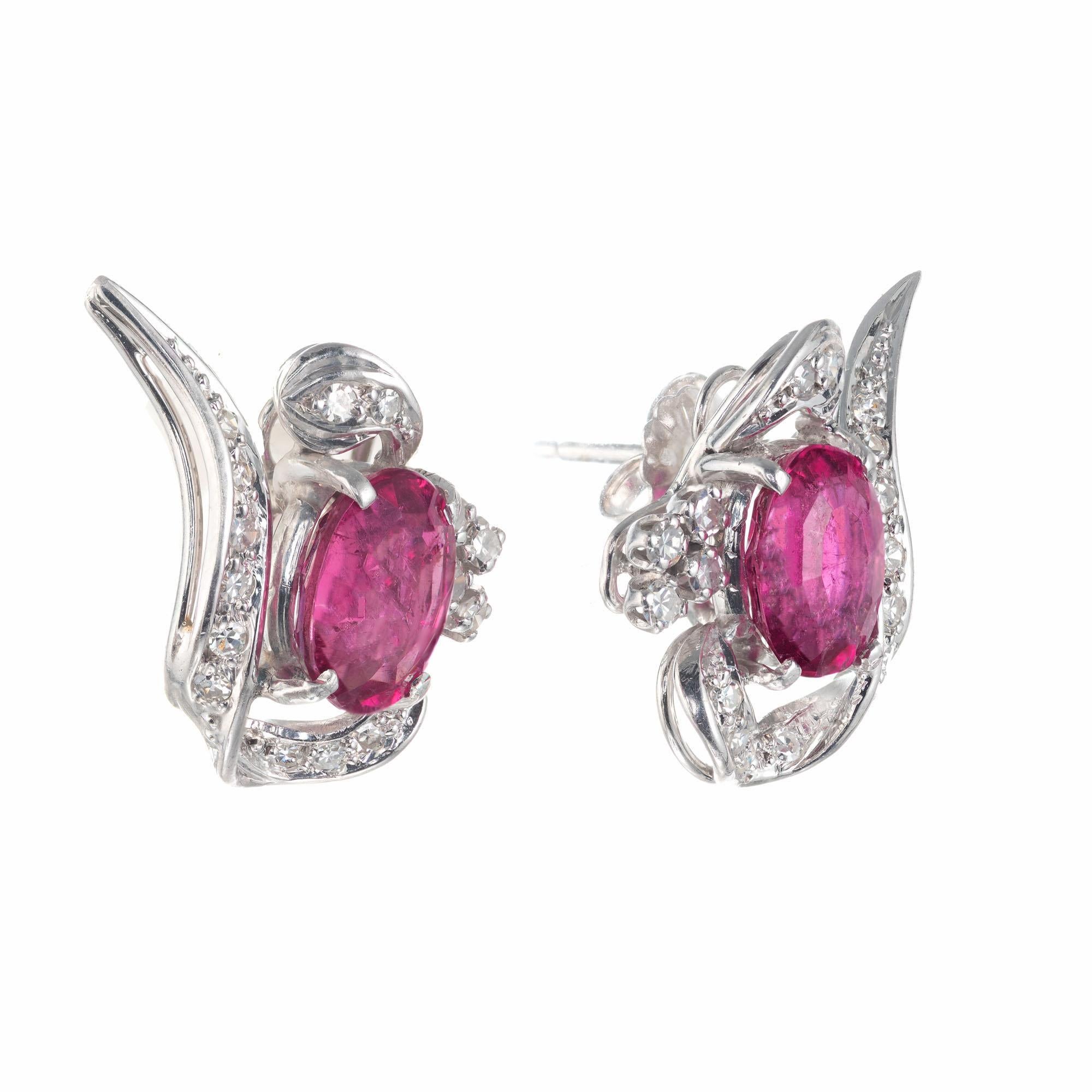 1960’s tourmaline diamond swirl earrings. 2 oval pink tourmaline's in 18k white gold swirl design settings with 32 single cut accent diamonds. 

2 oval pink tourmaline, SI2-I approx. 3.10cts
32 single cut diamonds, H-I VS-SI approx. .24cts
18k white