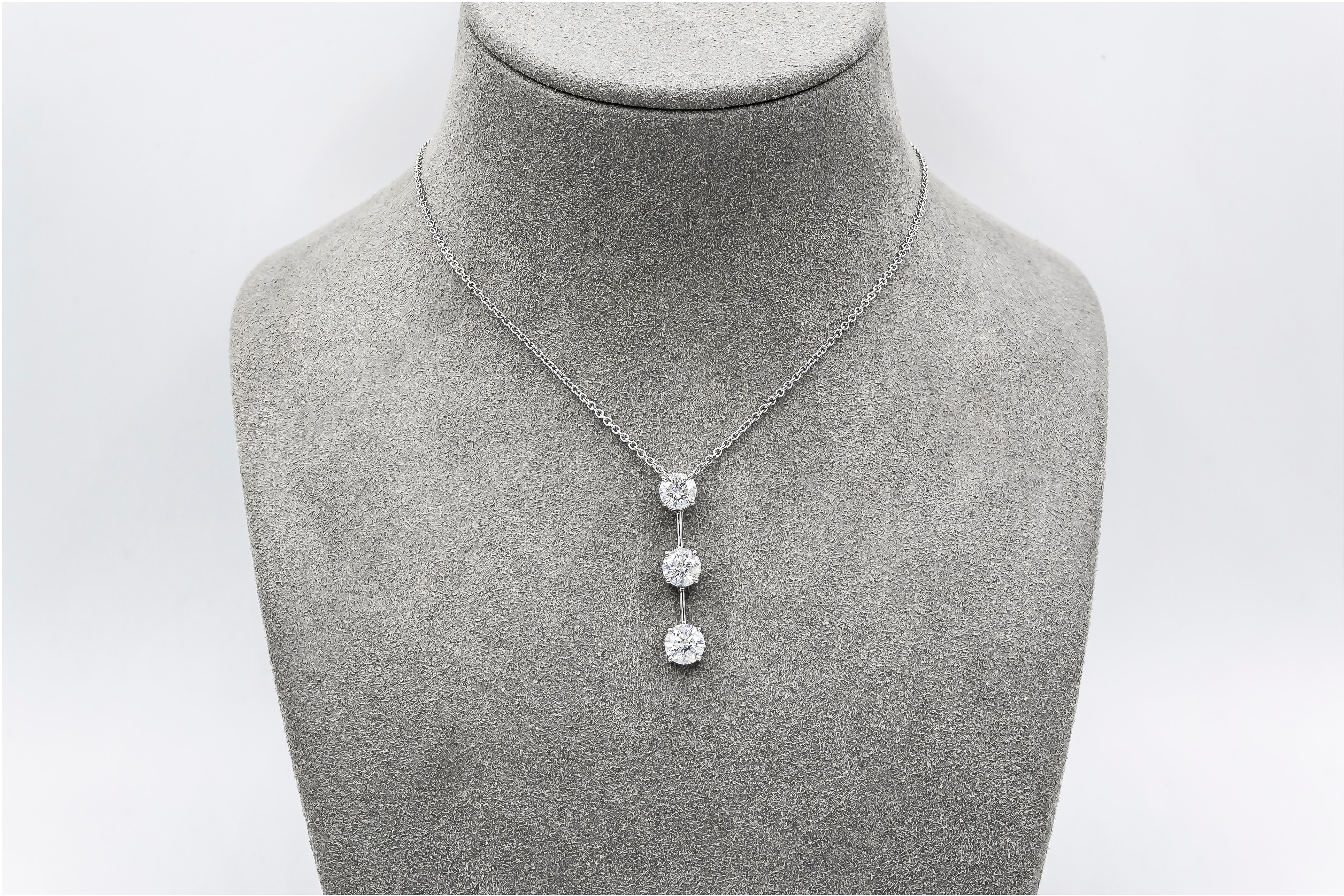 A brilliant pendant necklace showcasing three round brilliant diamonds, set in a line. Composition made in 14 karat white gold. Diamonds weigh 3.10 carats total.

Style available in different price ranges. Prices are based on your selection of the