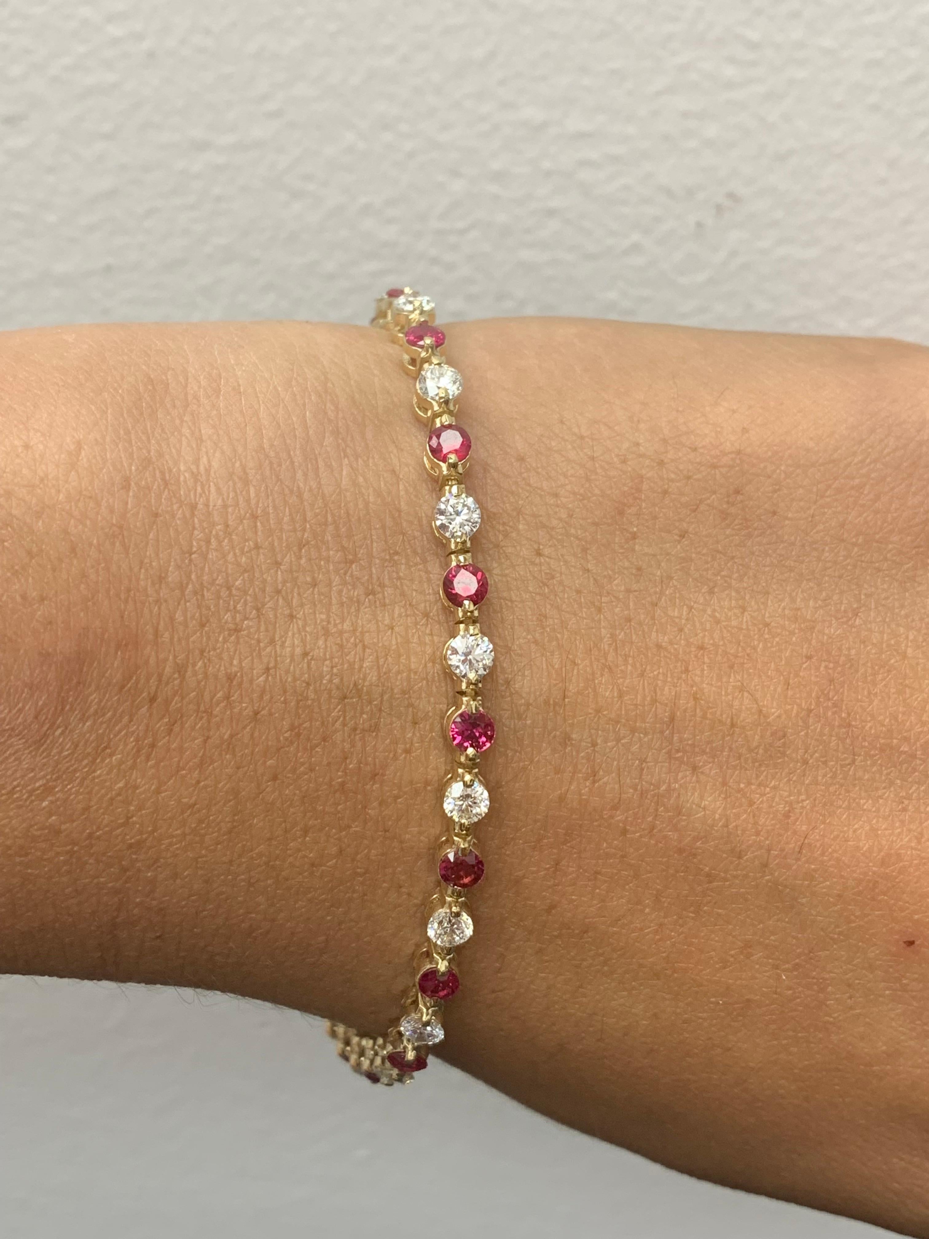 A stunning bracelet set with 18 stunning Red Rubies weighing 3.10 carat total. Alternating these Rubies are 18 sparkling round diamonds weighing 2.50 carats in total. Set in polished 14k yellow gold. Double lock mechanism for maximum security. A