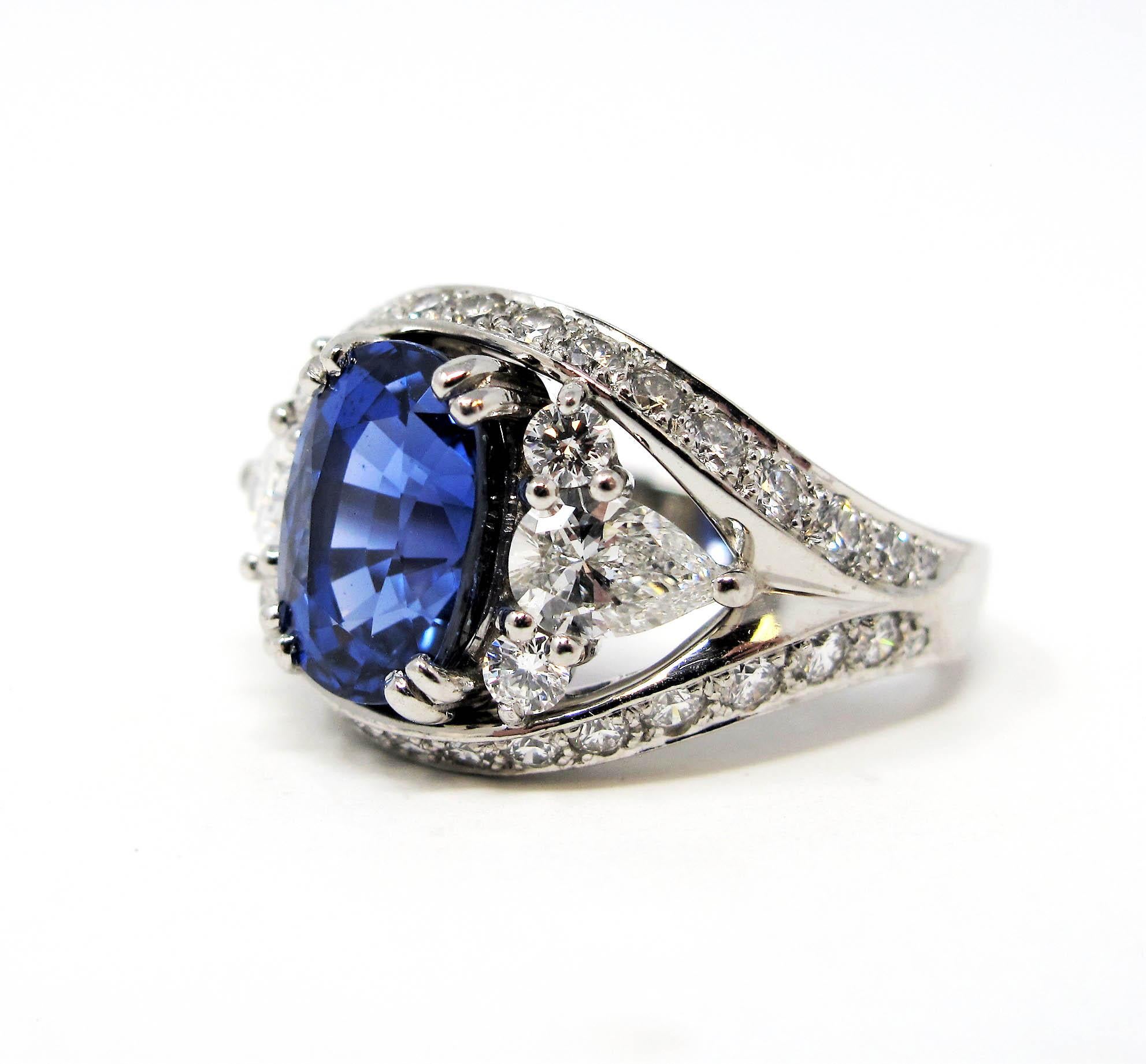 Absolutely breathtaking sapphire and diamond ring. The brilliant blue stone against the bright white diamonds really catches the viewers eye. Exquisite detail work combined with the incredible, untreated sapphire stone, makes this ring a true