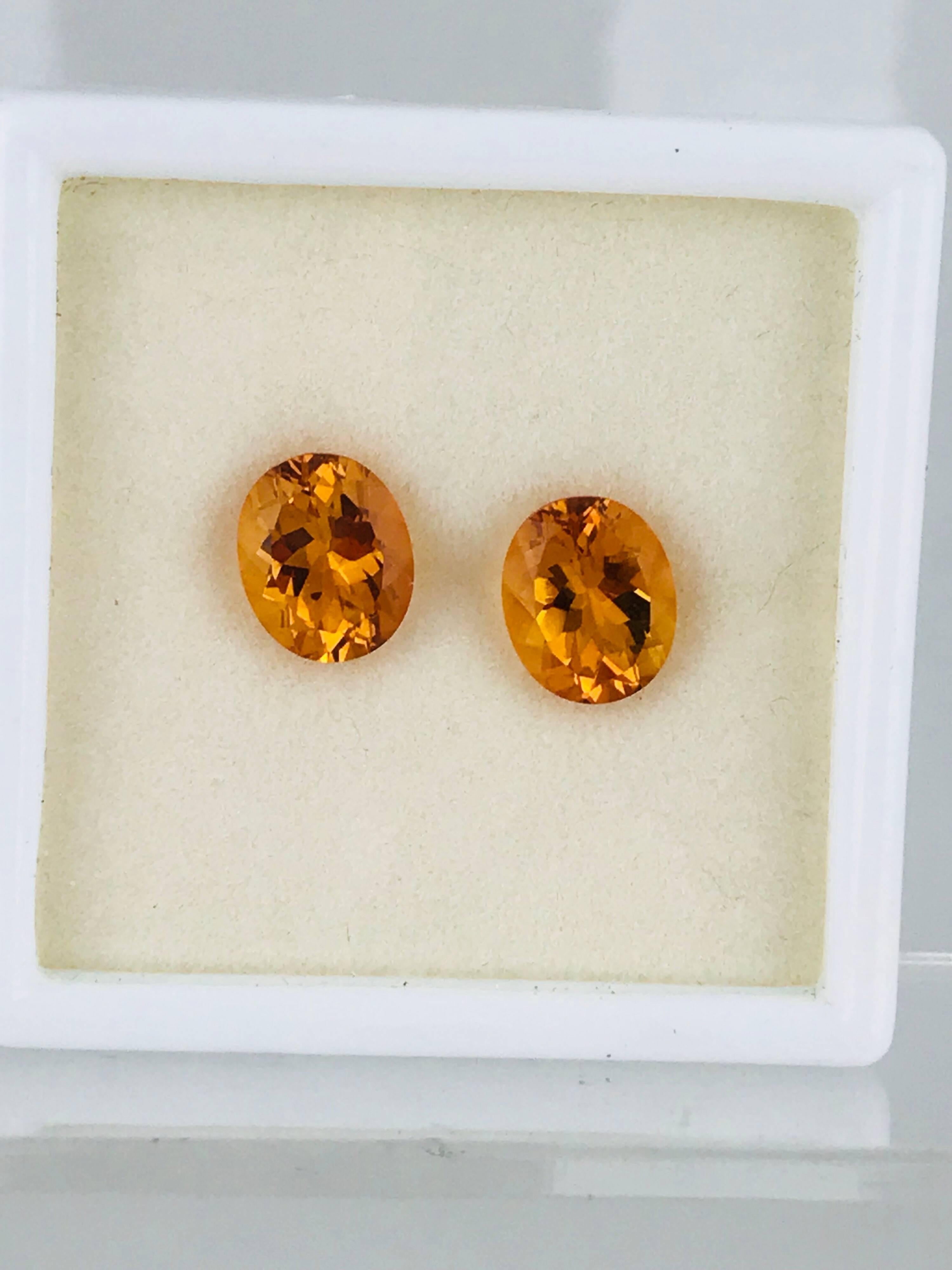 Set of matching oval 3.10 carat total weight Citrine. Vibrant colored, brilliant oval cuts. 
The stones measure 11 x 9 x 6 millimeters for easy resetting designs.

GIA Gemologist inspected and evaluated