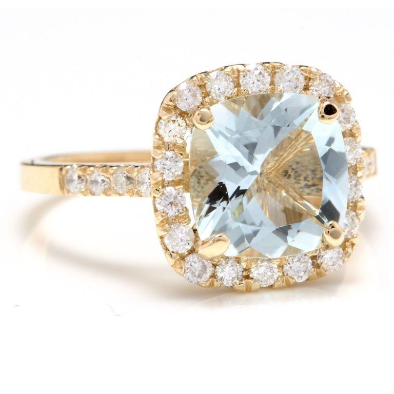 3.10 Carats Impressive Natural Aquamarine and Diamond 14K Yellow Gold Ring

Total Natural Aquamarine Weight is: Approx. 2.50 Carats

Aquamarine Measures: Approx. 9.00mm x 9.00mm

Natural Round Diamonds Weight: Approx. 0.60 Carats (color G-H /