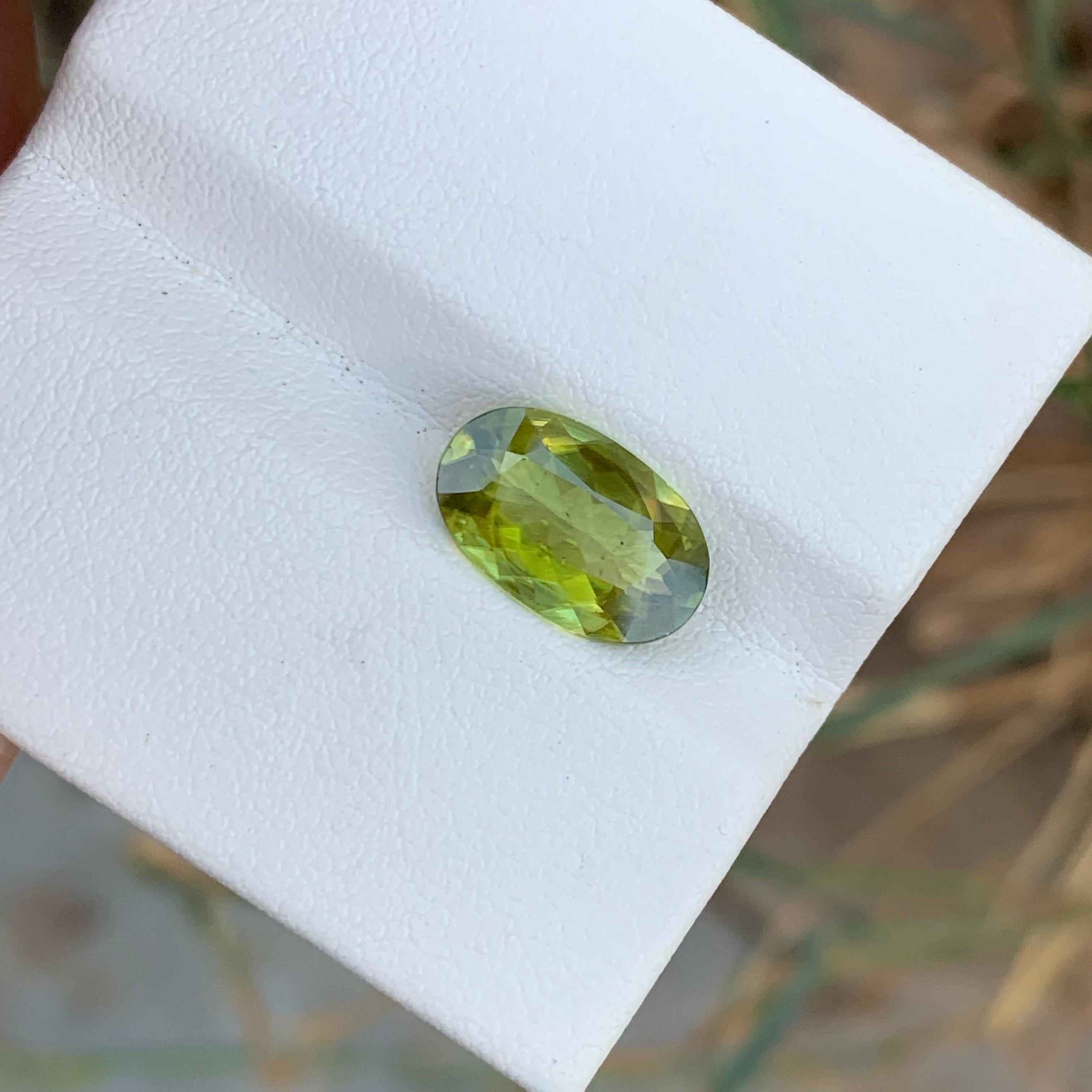 Faceted Sphene
Weight: 3.10 Carats 
Dimension: 10.6x7.4x5.8 Mm
Origin: Warsak Pakistan 
Color: Yellow Green With Fire Effect
Shape: Oval
Treatment: Non
Certificate: On Customer Demand 
Sphene, also known as titanite, is a rare and stunningly