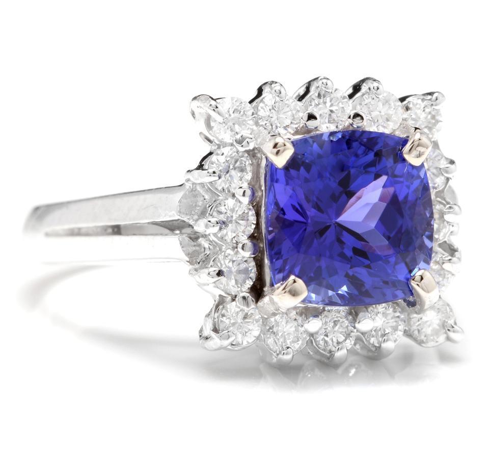 3.10 Carats Natural Very Nice Looking Tanzanite and Diamond 14K Solid White Gold Ring

Total Natural Cushion Cut Tanzanite Weight is: Approx. 2.50 Carats

Tanzanite Measures: 7.50 x 7.50mm

Natural Round Diamonds Weight: Approx. 0.60 Carats (color