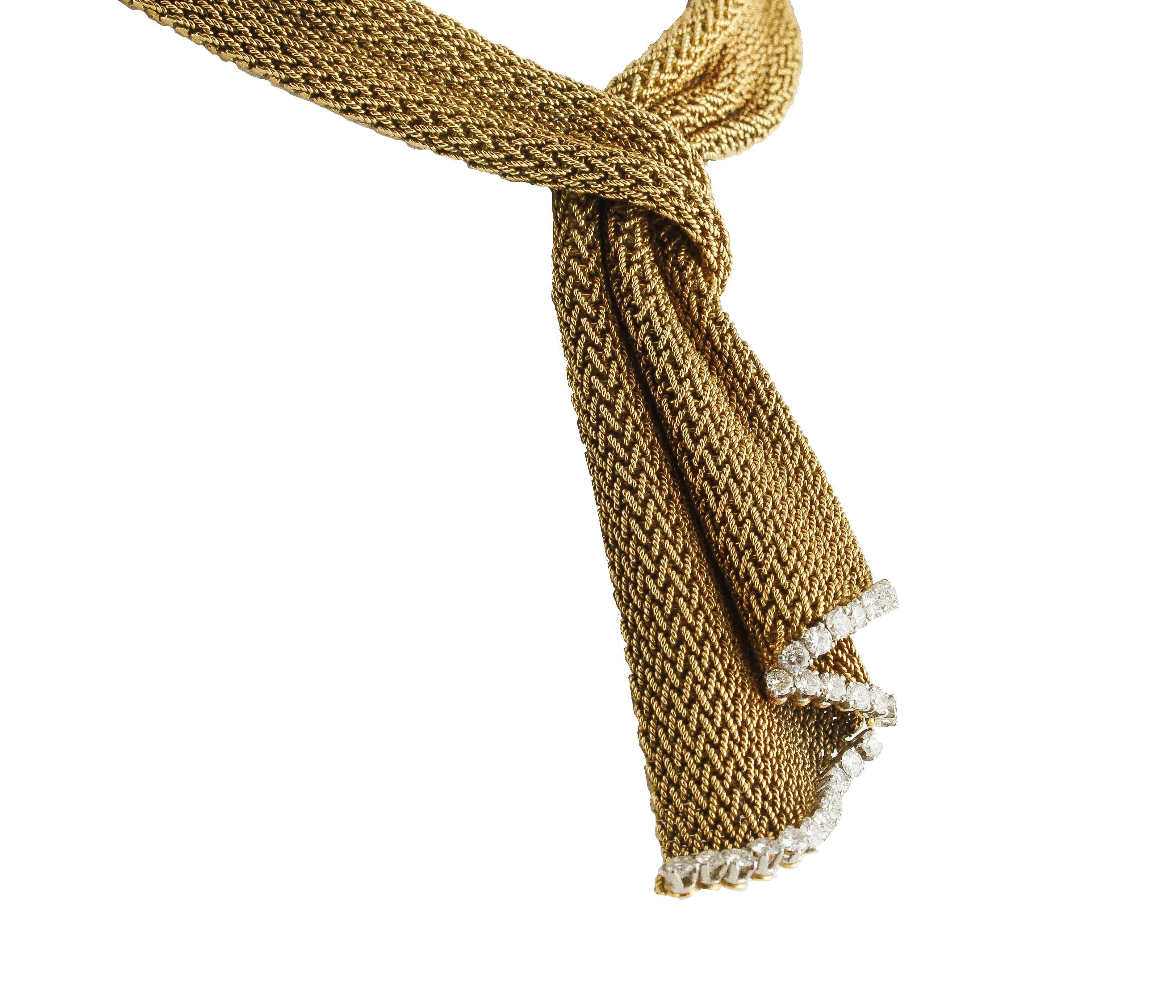 Fabulous French necklace, vintage knitted woven in 18 kt yellow gold, elegant and unique detail, with a soft scarf-shaped design, adorned with ct 3.10 of diamonds  (J color VVS1 )
Diamonds ct 3.10 (JColor VVS1 )
Total weight g 139.00
REF ueuor
