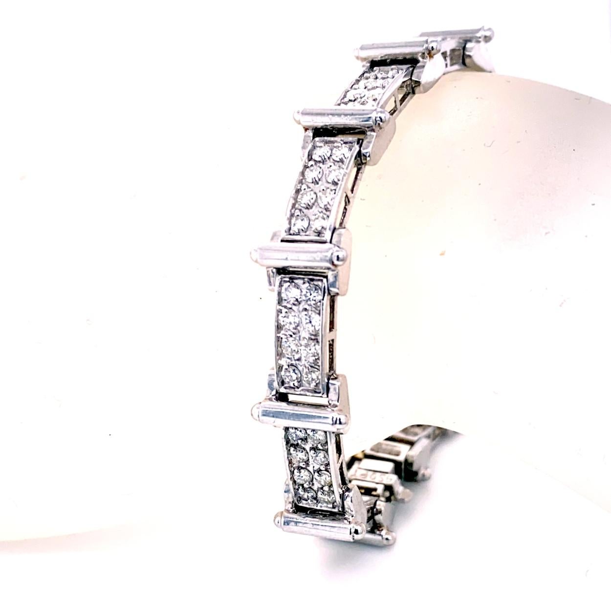 This Diamond Bracelet consists of 14 Links of Pave Set Round Brilliant diamonds set in Platinum.   The bracelet comes with a  Built-in safety lock to protect it from loss. 
Total Weight of diamonds: 3.10 Ct 
Total Weight of bracelet: 34.0 gr