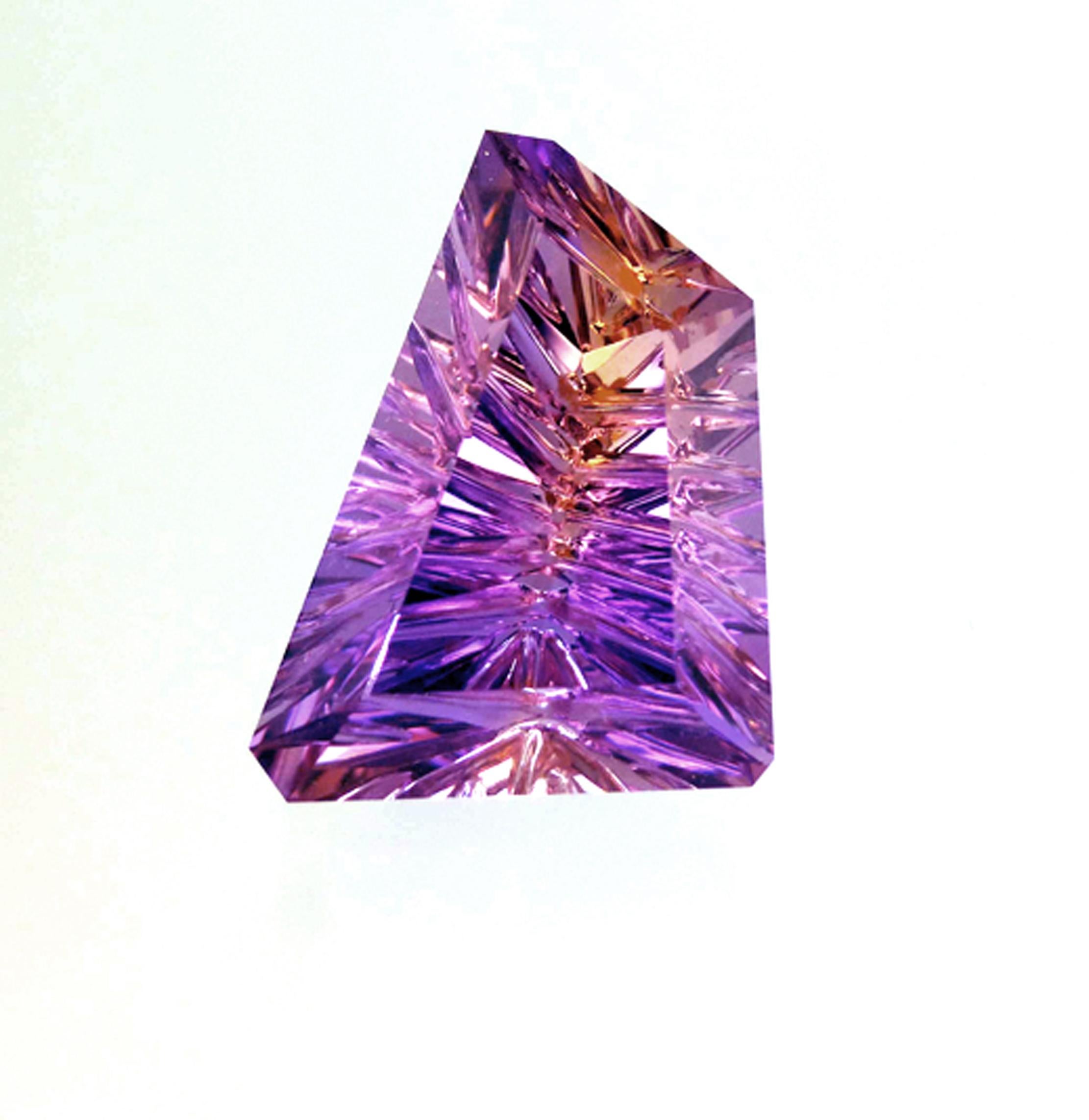 New Lower Price....

A Freeform Hand Grooved Ametrine weighing 31.00ct, faceted by our U.S. cutting specialist from carefully chosen blended amethyst and citrine rough. We obtain our hand-picked Ametrine rough for All That Glitters directly from the