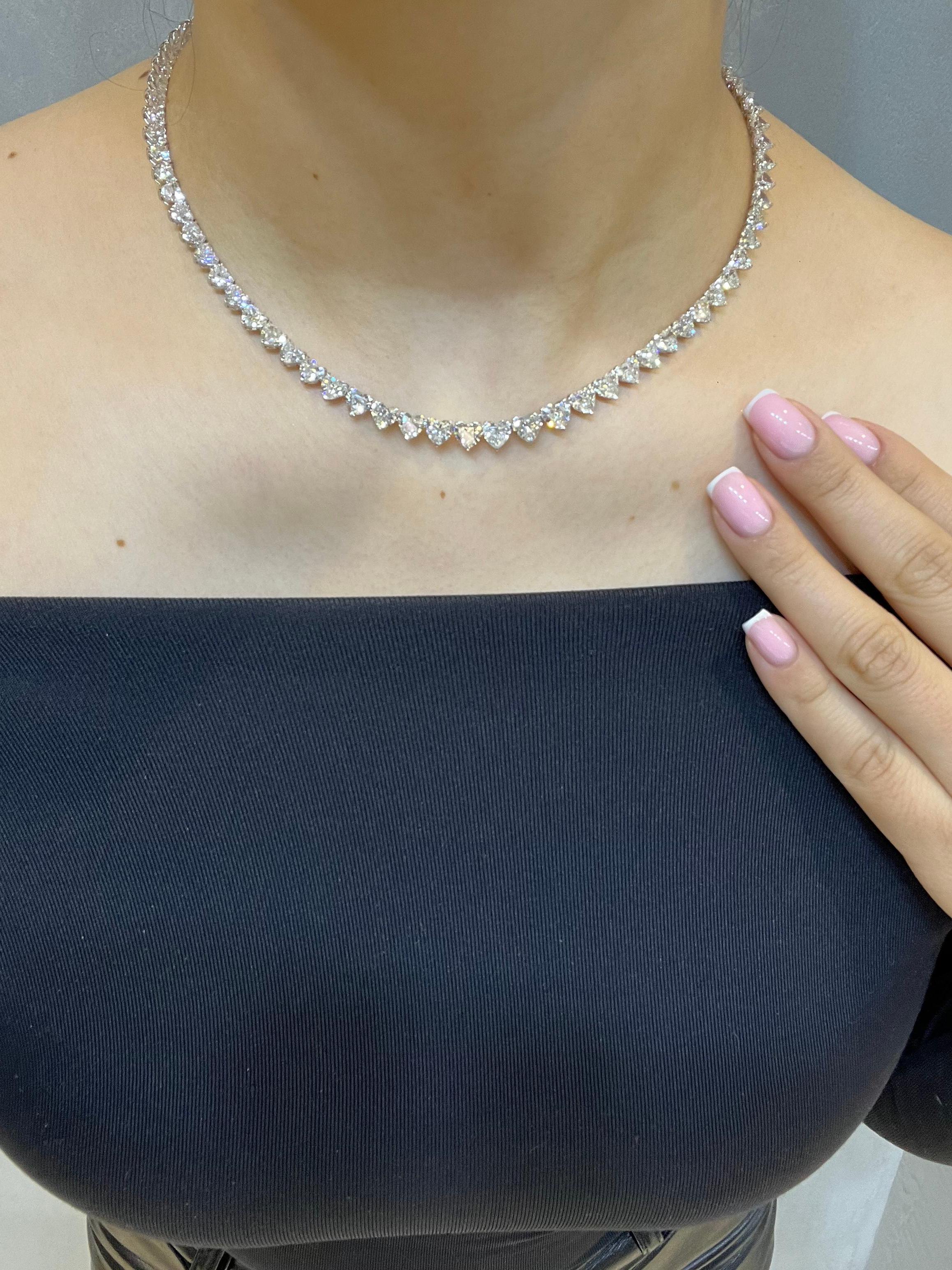 Behold, a truly unique diamond necklace inspired by Drake himself! This exquisite piece boasts a magnificent 31.02 ct heart-shaped stone, with a pristine G-H color and VS clarity. The earth-mined diamonds are masterfully set in 18k white gold, for a