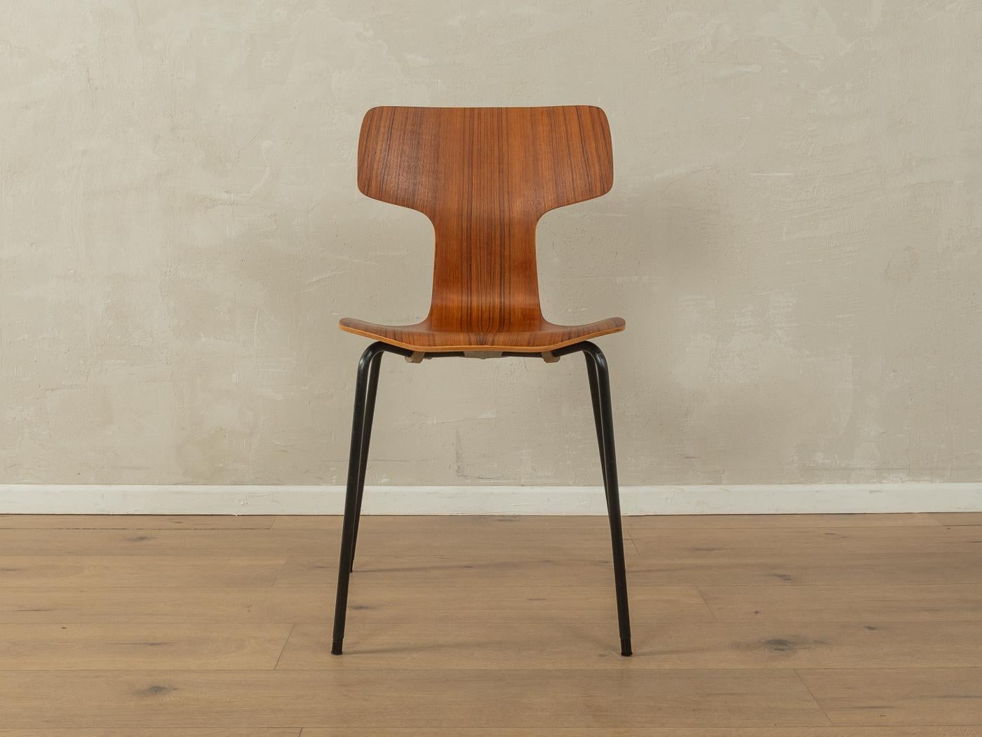 3103 HAMMER CHAIRS from the 1960s by Arne Jacobsen for Fritz Hansen. High-quality stainless steel frame with plywood seat shell in teak. The offer includes four chairs.

Quality Features:
accomplished design: perfect proportions and visible