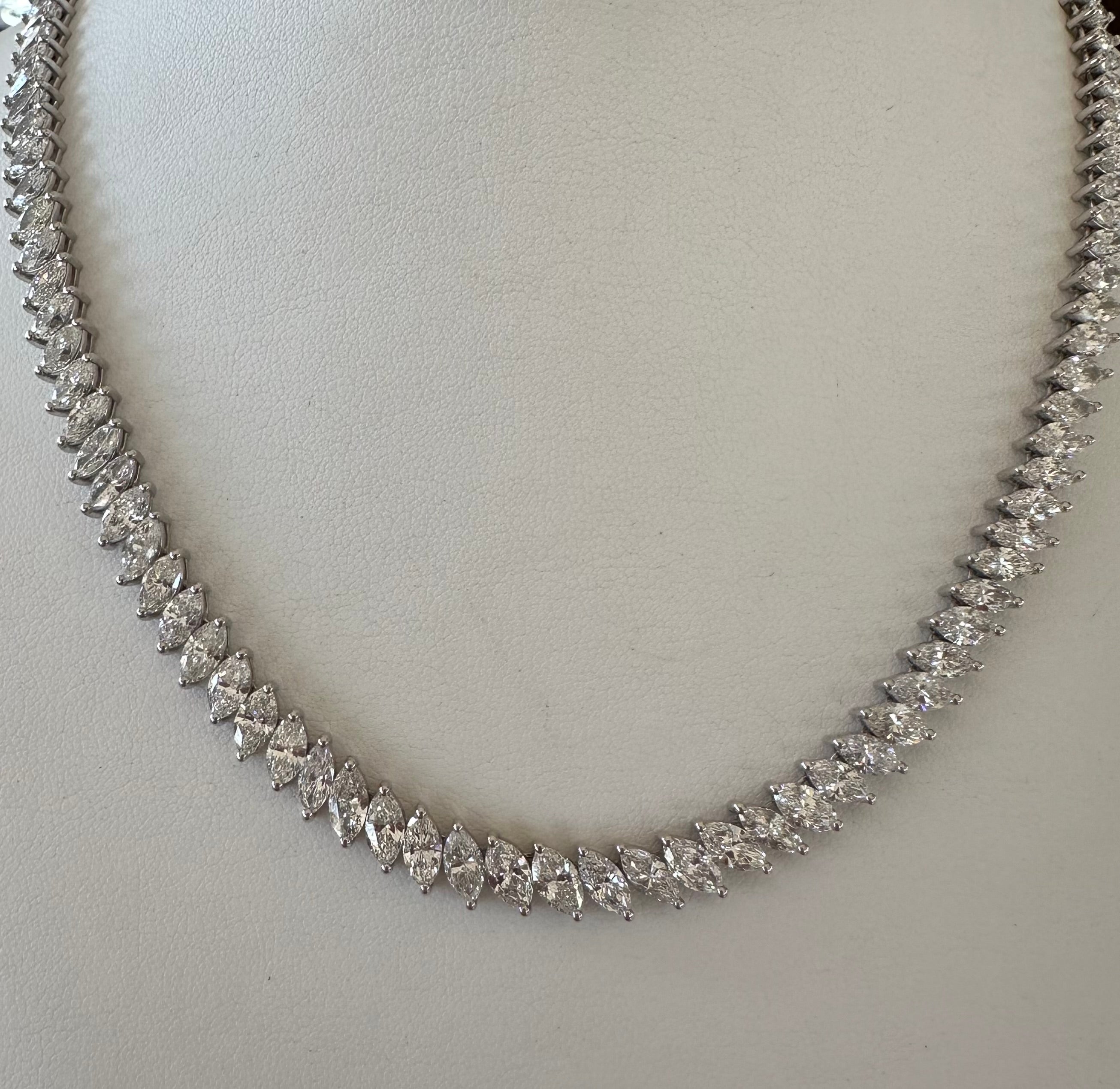 This timeless and elegant graduated diamond necklace showcases a magnificent array of 127 dazzling marquise-shaped diamonds, GH color, SI12 clarity, together weighing 31.05 carats. The necklace measures 17 inches long. Handcrafted in 18K white gold.