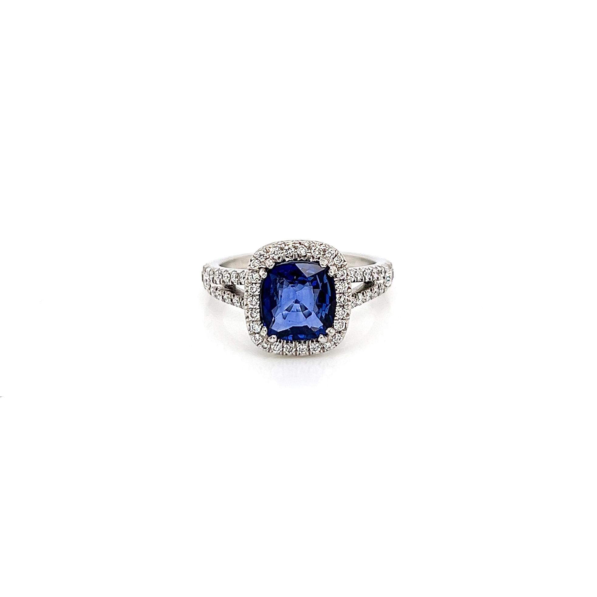 3.10 Total Carat Sapphire and Diamond Halo Pave-Set Ladies Ring

-Metal Type: Platinum
-2.21 Carat Cushion Cut Natural Blue Sapphire, Heated  
-0.89 Carat Round Natural side Diamonds. F-G Color, VS Clarity 

-Size 6.0

Made in New York City.