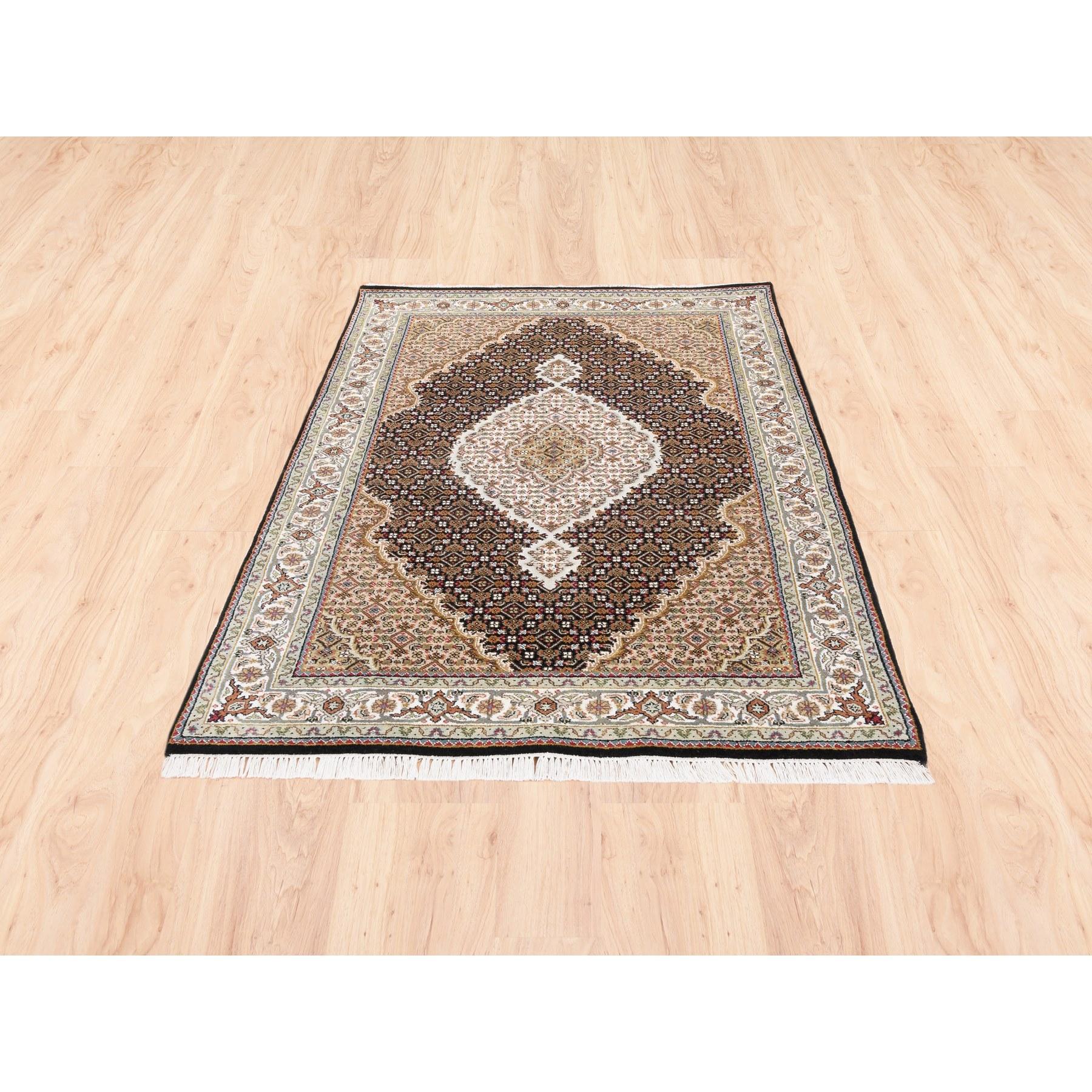 This is a truly genuine one-of-a-kind Hand Knotted Black Tabriz Mahi Fish Medallion Design Wool Oriental Rug. It has been Knotted for months and months in the centuries-old Persian weaving craftsmanship techniques by expert artisans.
Primary
