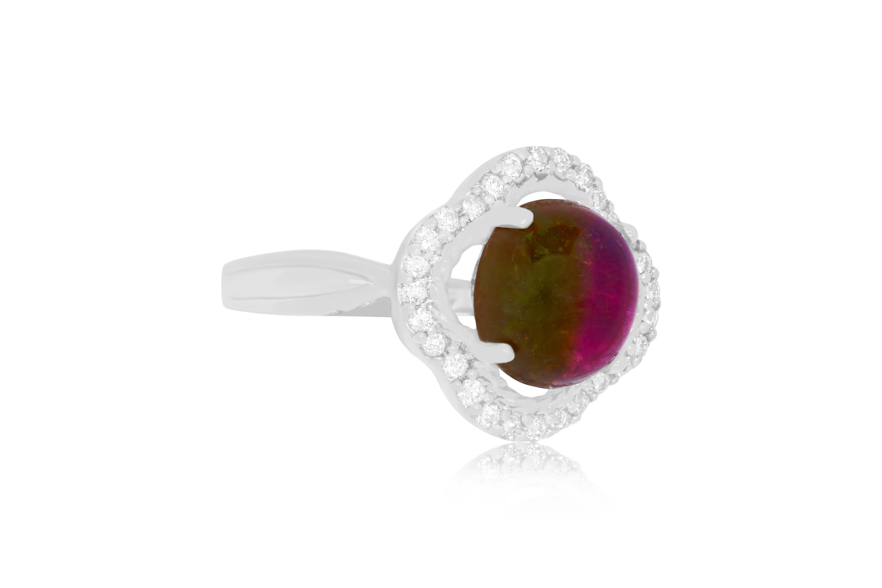 Take a bite out of summer with this unique Oval Shaped Bicolored Tourmaline Ring. Encased in 0.25 carats of brilliant white diamonds, this is a must have!

Material: 14K White Gold
Center Stone Details: 3.11 Carat Oval Shaped Bicolored Tourmaline -