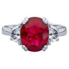 3.11 Carat Oval Cut Natural Thai Ruby Ring with 0.50 Carat Total of Diamonds