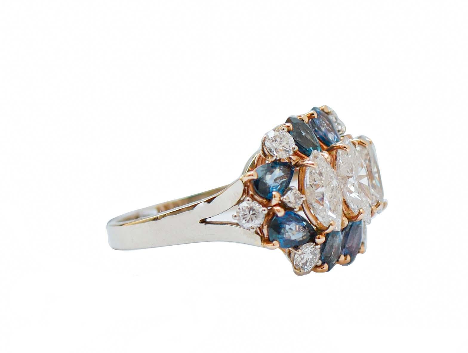 Elegant ring in 14 kt white gold structure mounted with three central navette diamonds surrounded by drop sapphires and diamonds.
This ring was totally handmade by Italian master goldsmiths and it is in perfect conditions.
Diamonds 0.86 ct
Navette