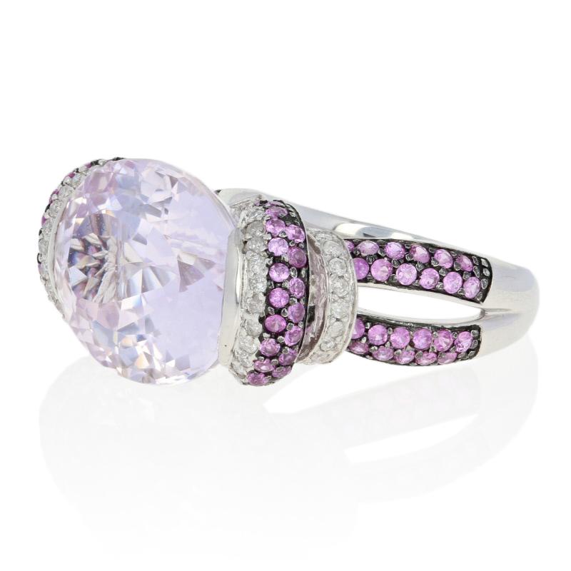 Light up those special occasions wearing jewelry to highlight your signature color - pink! Fashioned in a glamorous cocktail style, this 14k white gold showcases a breathtaking Kunzite solitaire that is beautifully cradled between pink sapphire and