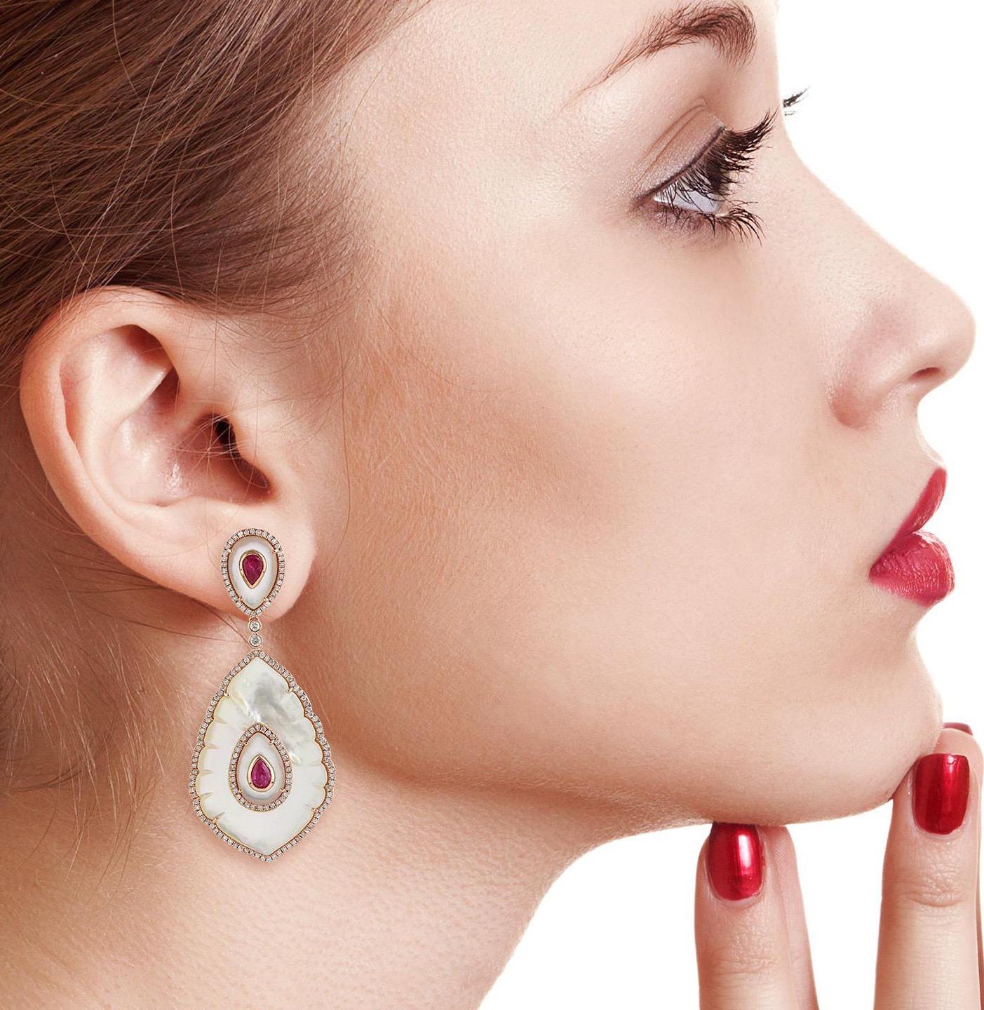 Inspired by the beautiful Taj Mahal. Hand cast from 18-karat gold, these stunning earrings are set with 1.45 carats ruby, 31.17 carats mother of pearl and 1.9 carats of glimmering diamonds. 

FOLLOW  MEGHNA JEWELS storefront to view the latest