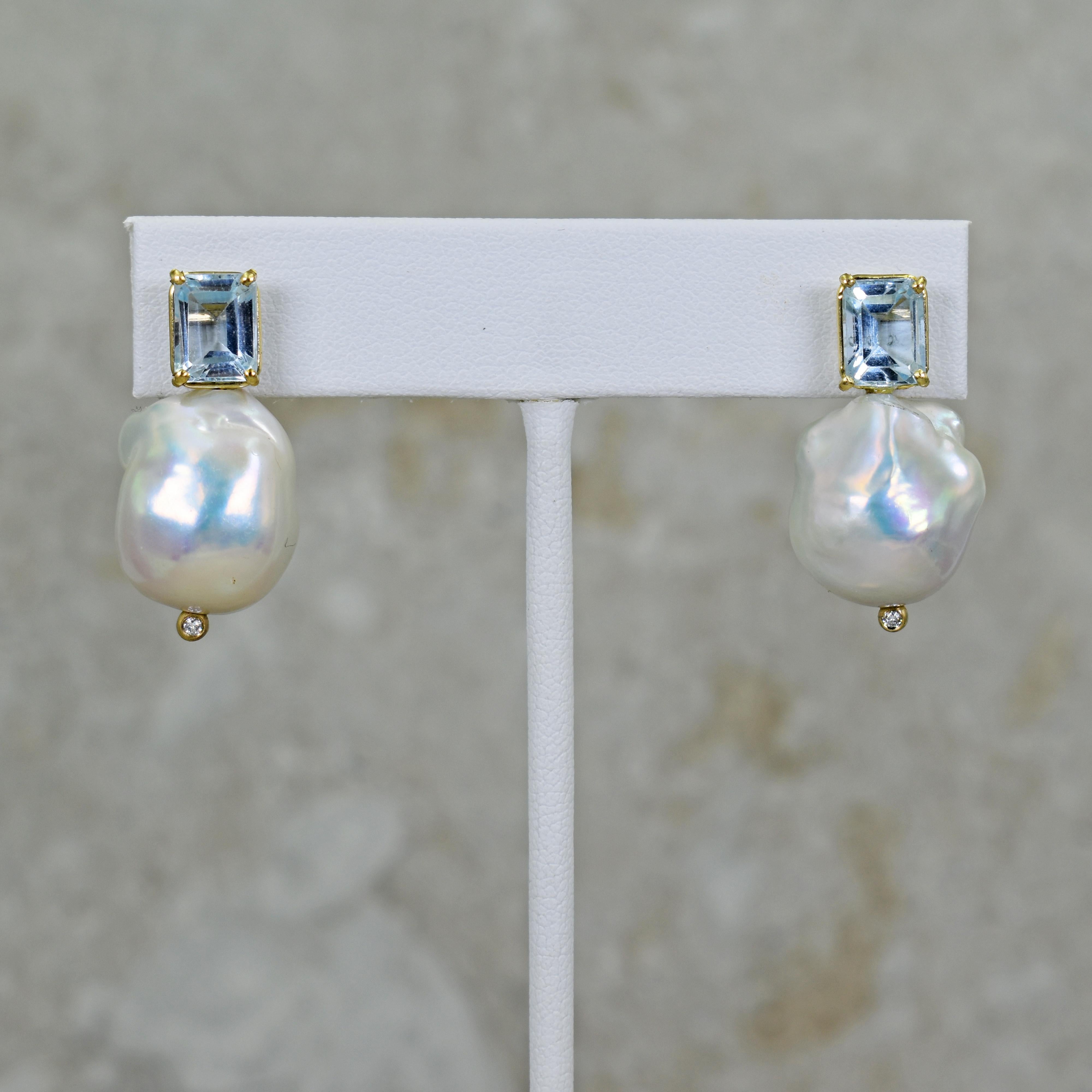 Gorgeous and unique 14k yellow gold stud earrings featuring two emerald-cut Aquamarine gemstones, totaling 3.12 carats, with Freshwater Baroque Pearls and accent white diamonds. Stud earrings are 1.13 inches or 29 mm in length. These artisan drop