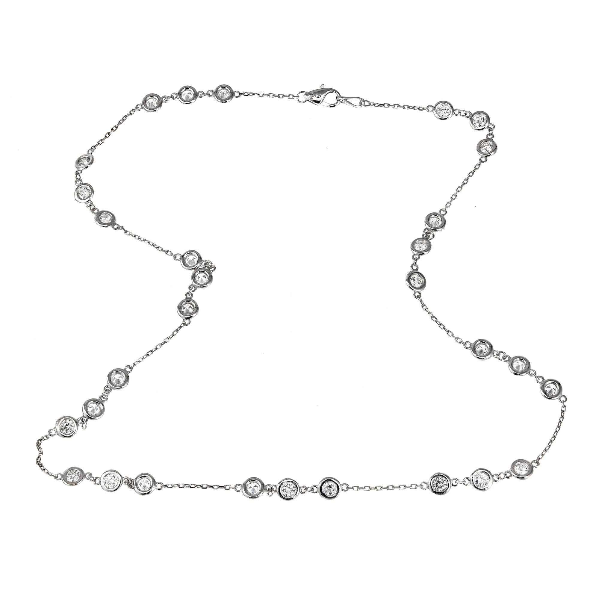 Round brilliant cut diamond by the yard bezel necklace. Set in 14k white gold, the bezels are linked together 3 at a time Through 10 stations. 14K white gold chain with lobster clasp.

30 Round Brilliant Cut Diamonds, Approximate 3.12ct Total, H-I