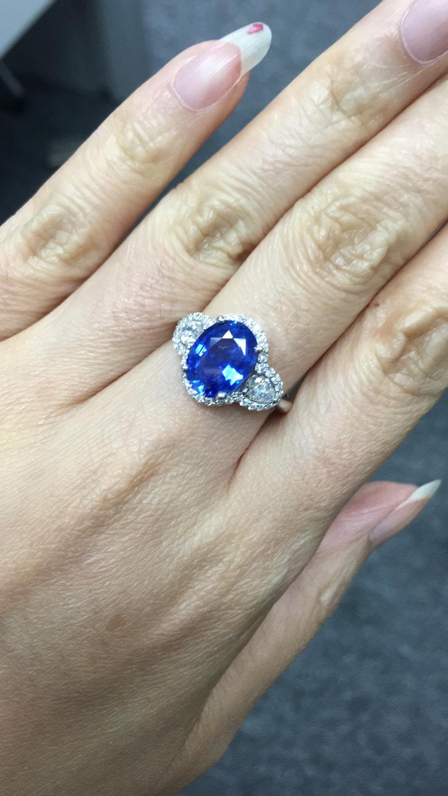 Primary Stone: Sapphire ( Sri Lanka )
Shape : Oval Cut
Sapphire Weight: 3.12 Carats (1 Sapphire)
Measurements Sapphire: 10.35 mm x 7.95 mm x 4.28 mm
Color: Vivid Blue
Accent Stones: Genuine Diamond
Shape Or Cut Diamond: 2 Pearl Brilliants & Numerous