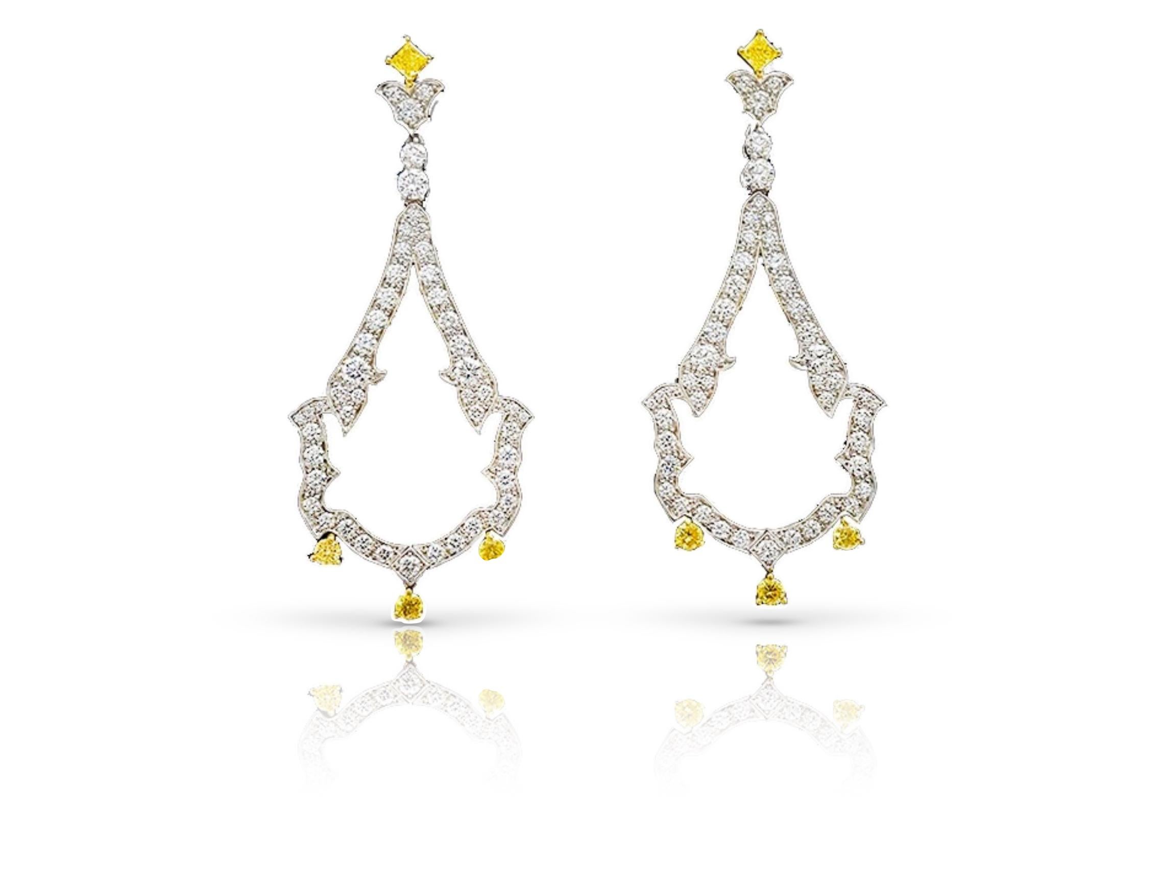 Introducing a truly magnificent and elegant pair of Open-Work Dangle Earrings, showcasing a harmonious blend of yellow and colorless round brilliant diamonds F-G color, VS clarity, meticulously set in an open-work pear-shaped design. These exquisite
