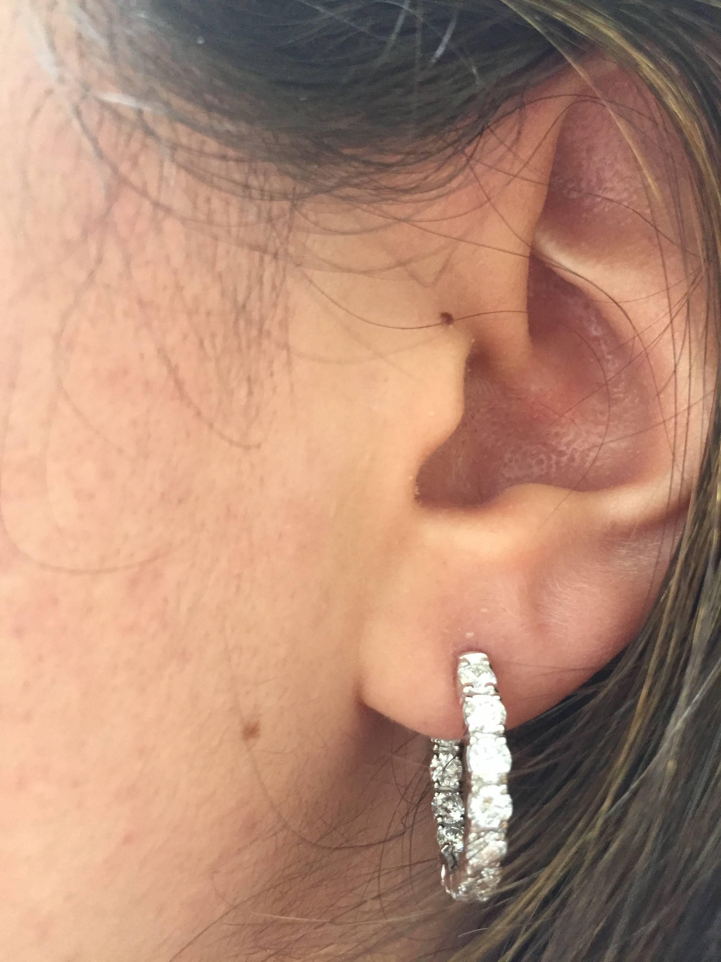 These hoops are 1 inch diameter, the stones are set outside as well as inside the earring. This is a very elegant and wearable diamond hoop. Each stone is 15 pts. The total weight is 3.12 carat.