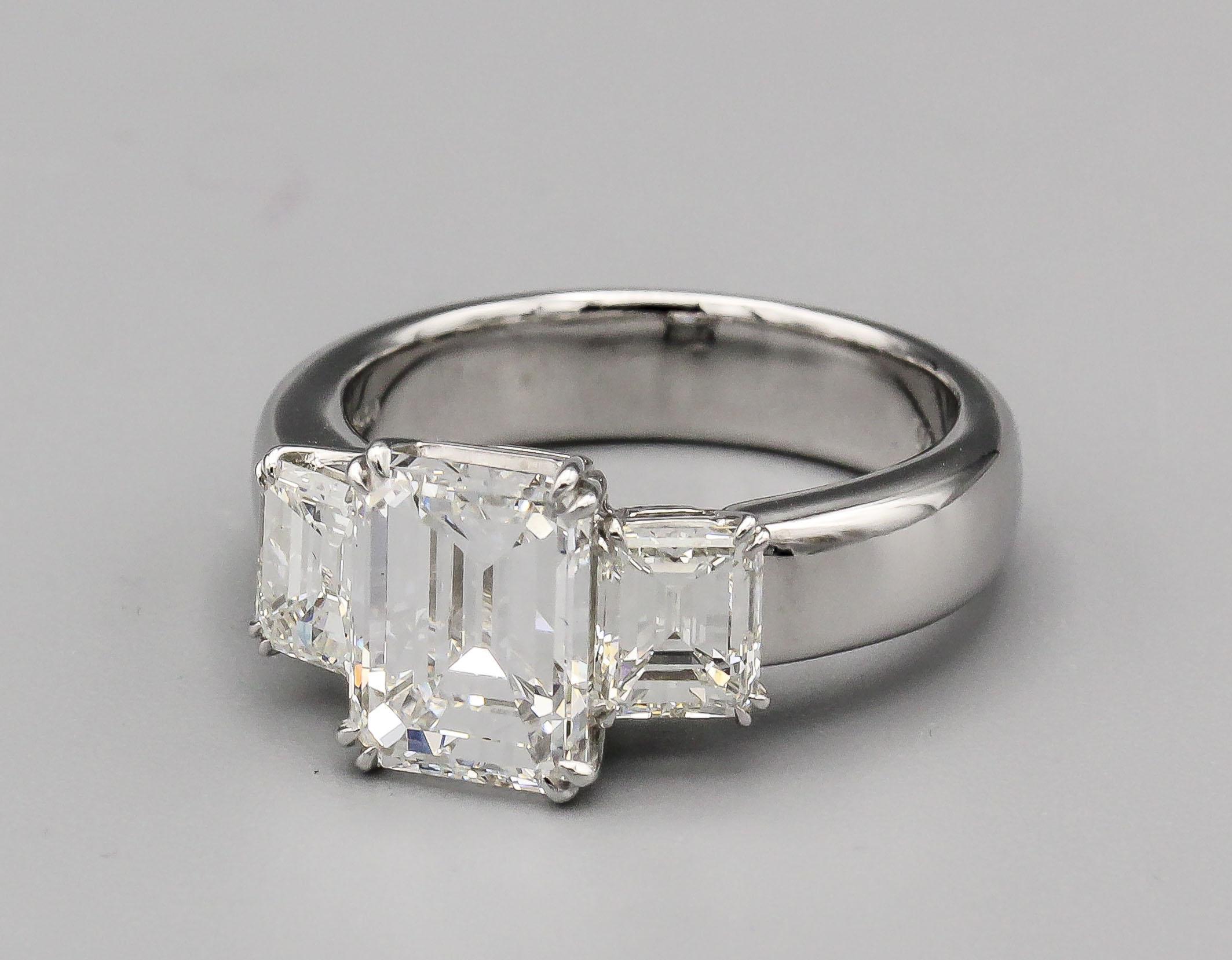 Elevate the moment of a lifetime with the Platinum and Emerald-Cut 3.12 Carat E Color VVS1 GIA Certified Diamond Engagement Ring – an extraordinary masterpiece that embodies the pinnacle of love and luxury. This exquisite ring is a symbol of