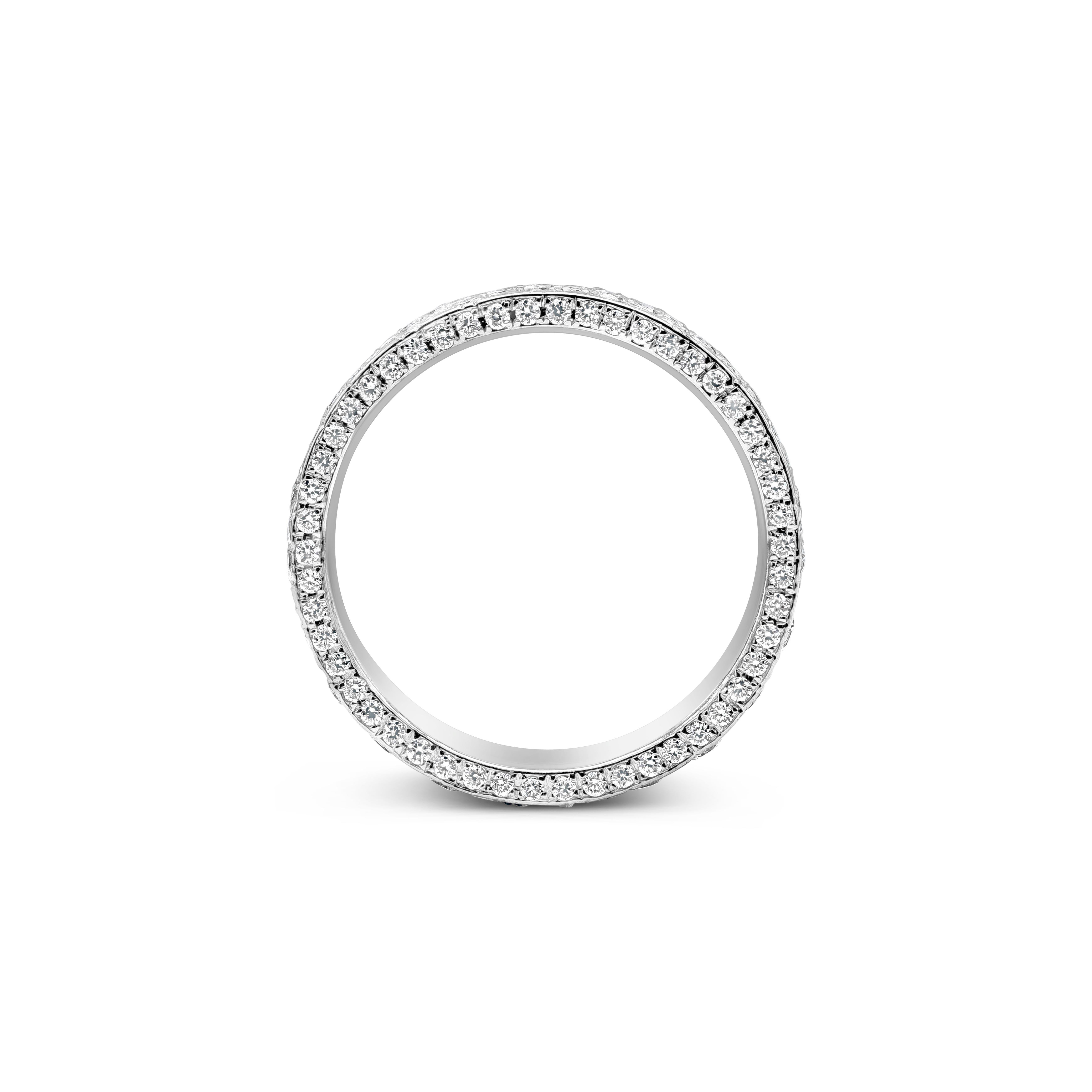 A unique and intricately-designed fashion ring showcasing a micro-pave of round brilliant diamonds weighing 3.12 carats total. Diamonds are 165 pieces in total, F color and VS in clarity. One side of the ring is accented with smaller round brilliant