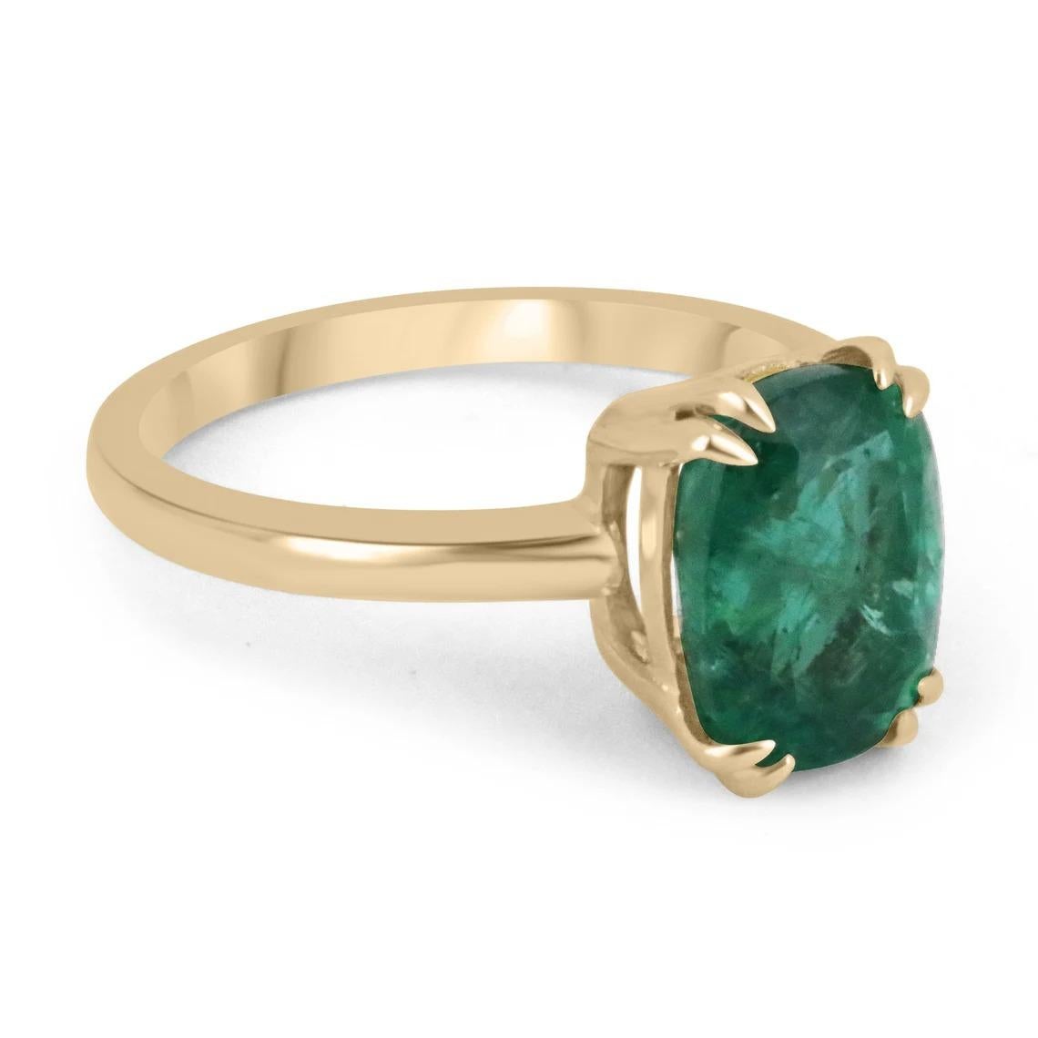 A stunning solitaire emerald ring. This gorgeous piece showcases a ravishing 3.12-carat, natural, fine-quality Zambian emerald. The gemstone displays an enthralling deep, lustrous, emerald green color with remarkable qualities. Securely double claw