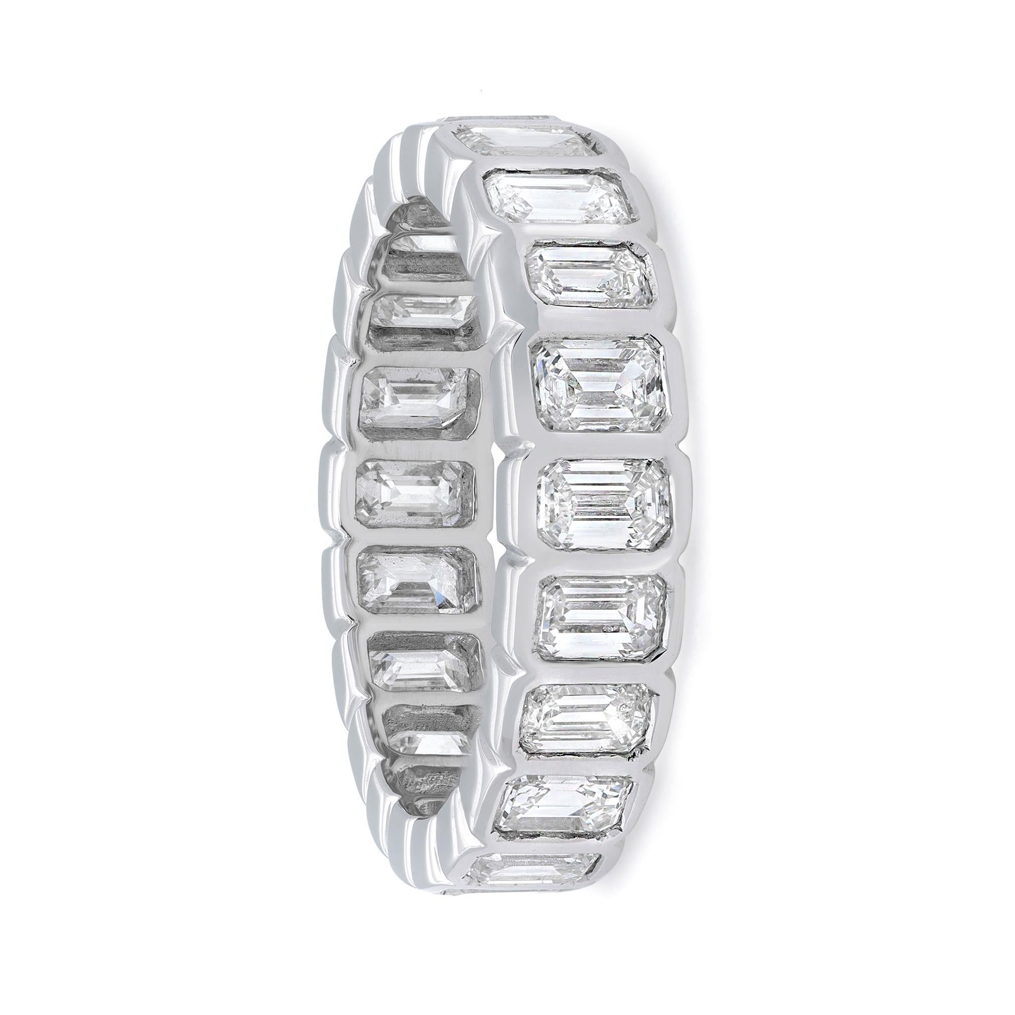 Celebrate everlasting love with this enchanting eternity band ring. Crafted in high polished 14K white gold. Showcasing 21 bezel set emerald cut dazzling diamonds beautifully encircling all the way around the band. Total diamond weight: 3.12 carats.