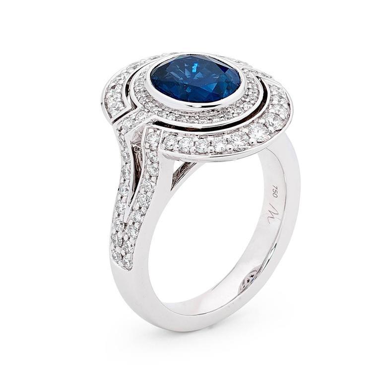 This magnificent 3.13ct Oval Blue Sapphire from Madagascar handpicked by Matthew Ely, is surrounded by a Twin Halo of 39 Round Brillant Cut Diamonds totalling 1.00ct (color G clarity SI) set into 18ct white gold.  The centre stone comes with a