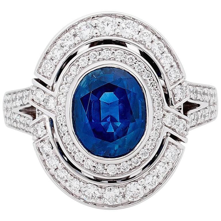 3.13 Carat Blue Sapphire 18 Carat White Gold Diamond Halo Ring For Sale