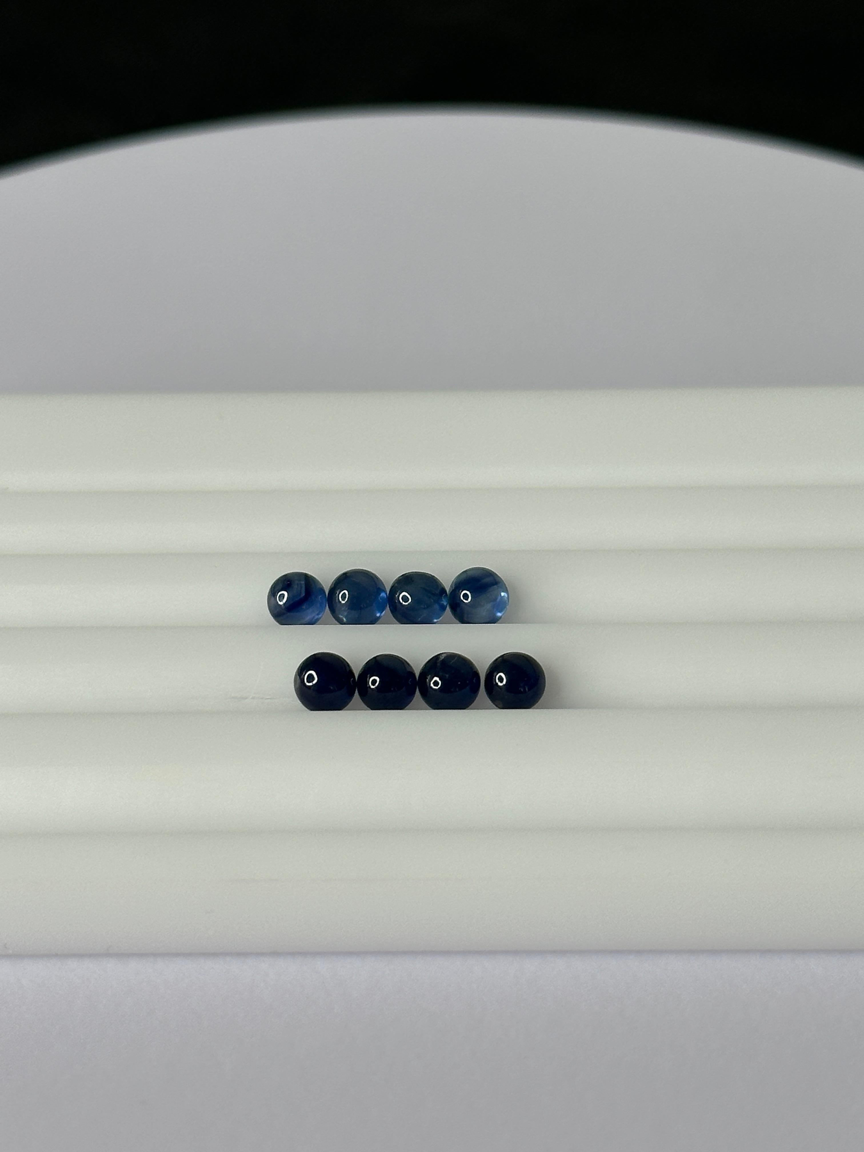 A lot of 8, 4mm blue sapphire cabochons amounting to a total of 3.13 carats in weight.

Weight: 3.13 carats
Shape: Round
Cut: Cabochon
Gem Dimensions: 3.85 - 4.00 x 2.35 - 2.65 mm
Color: Dark Blue

Mineral Type: Corundum
Gem Variety: Sapphire
