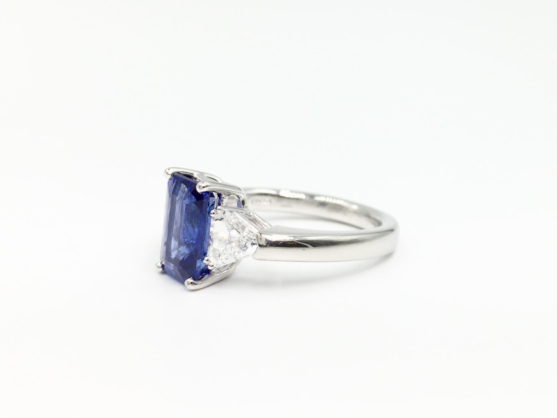 Contemporary 3.13 Carat Blue Sapphire Platinum Ring with Trillion Diamonds