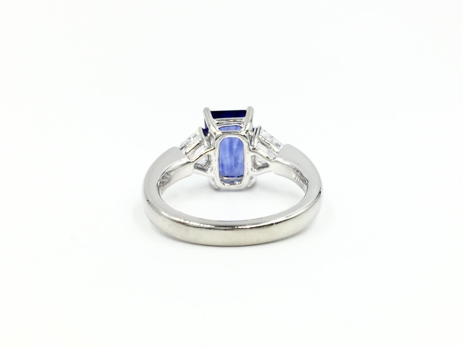 Emerald Cut 3.13 Carat Blue Sapphire Platinum Ring with Trillion Diamonds