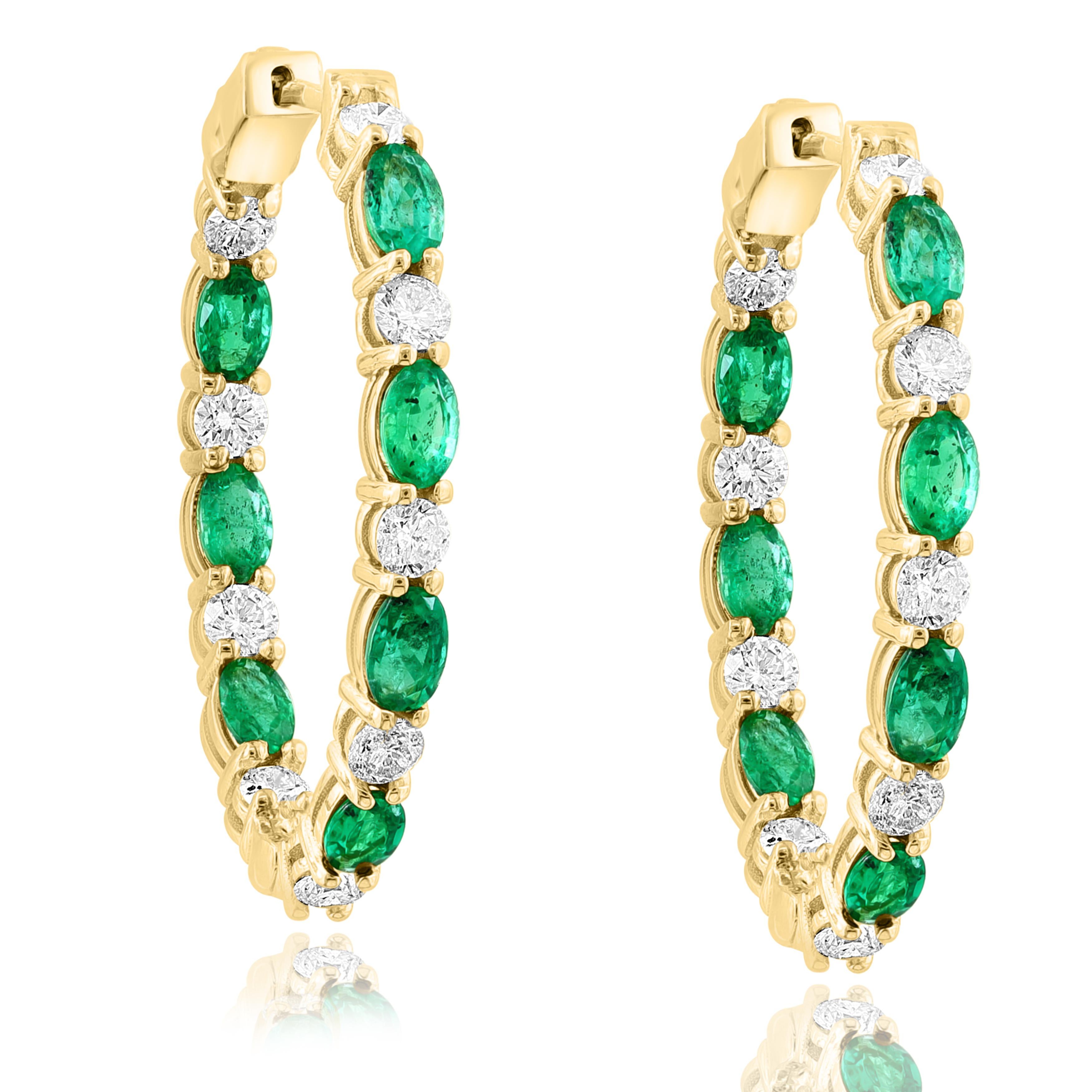 A stylish and versatile style hoop earring showcasing oval cut 14 Emerald weighing 3.13 carats total, channel set in a diamond-encrusted 14-karat Yellow gold mounting. 18 Diamonds weigh 1.79 carats in total.

All diamonds are GH color SI1