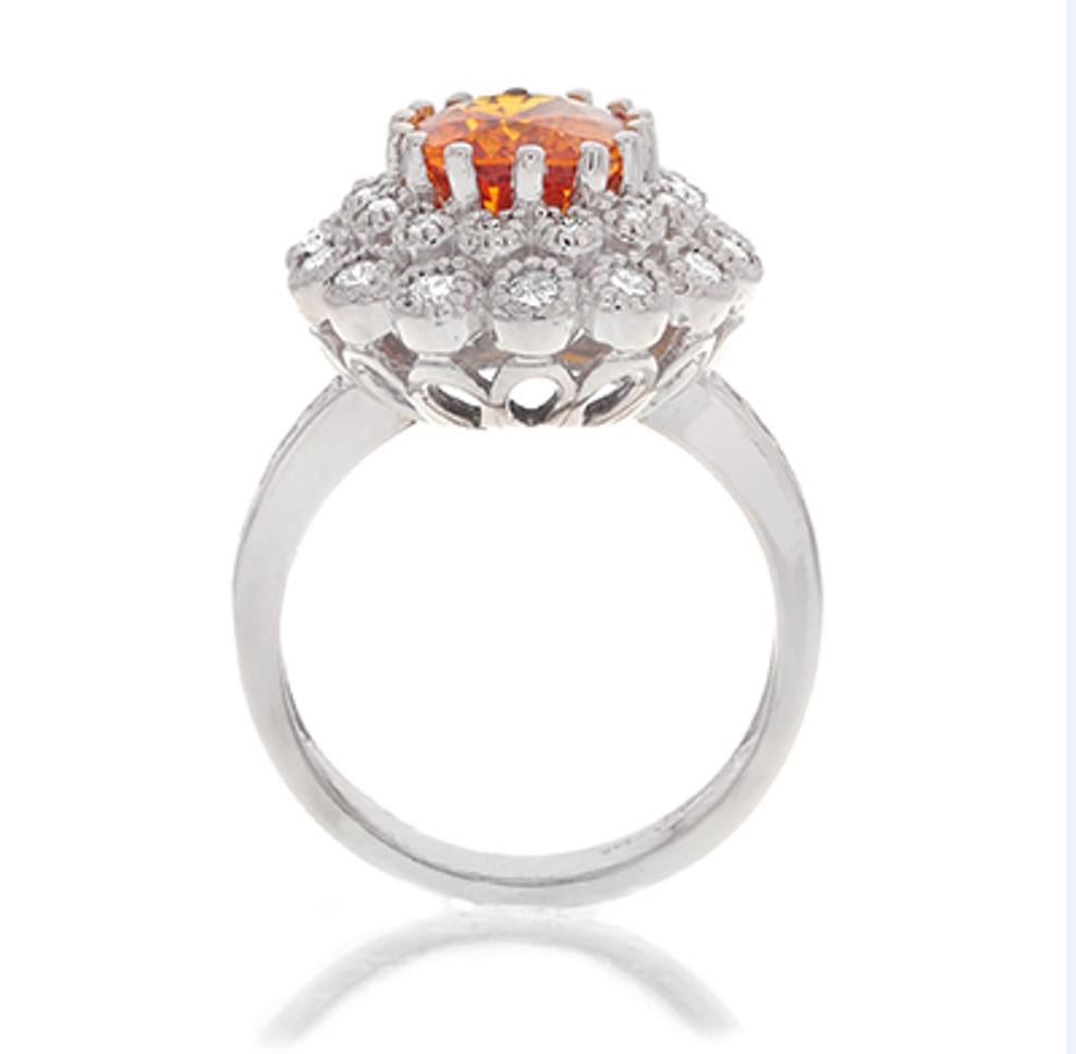 Contemporary 3.13 Carat Oval Cut Orange Sapphire Gemstone 14 Karat White Gold Diamond Ring For Sale