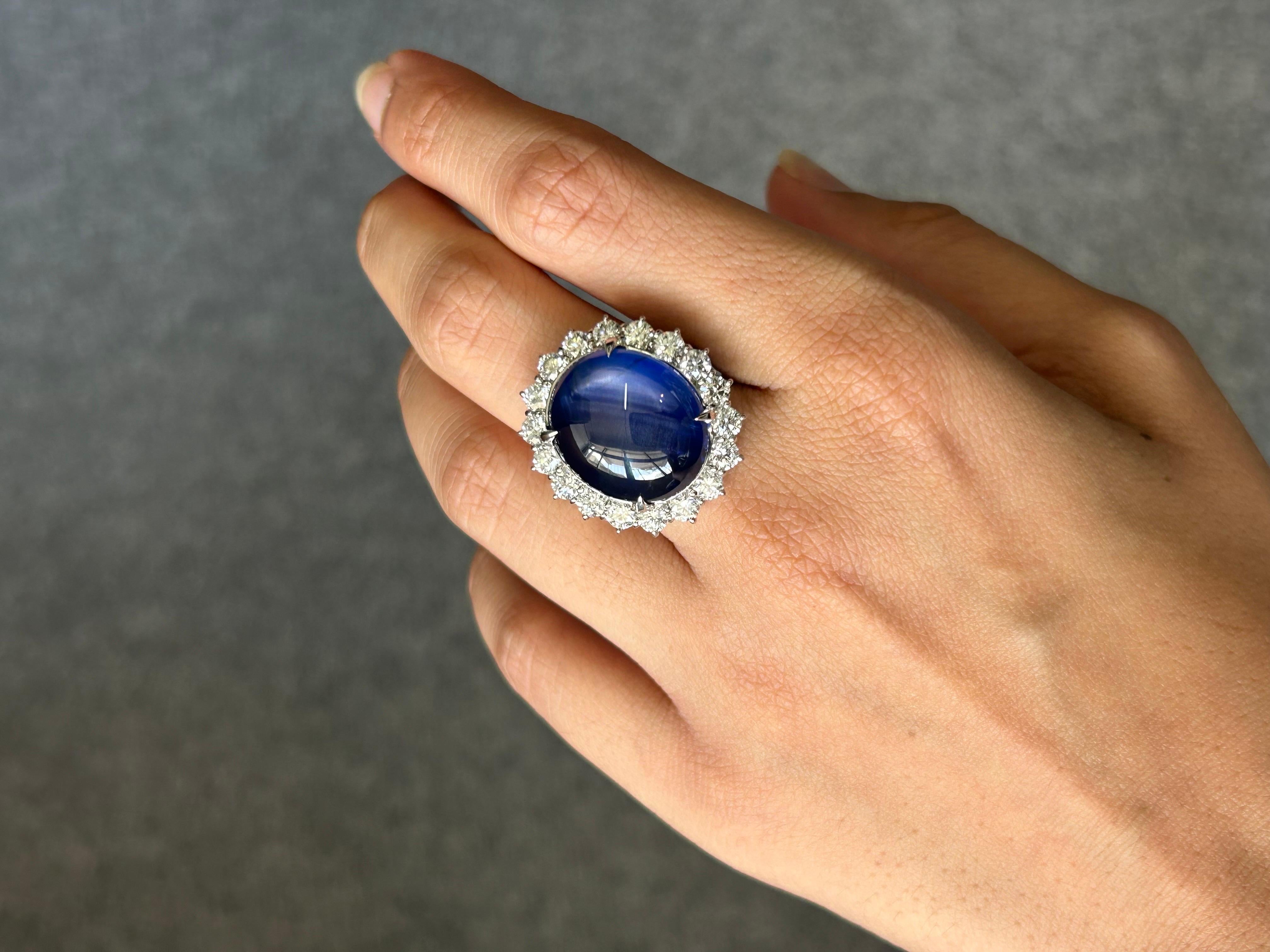A stunning, one of a kind Burmese no heat Star Sapphire ring, weighing 31.36 carats adorned with 2.3 carats of White Diamonds. The center stone has a beautiful blue color, with a star reflecting off it when under direct light. Currently sized at