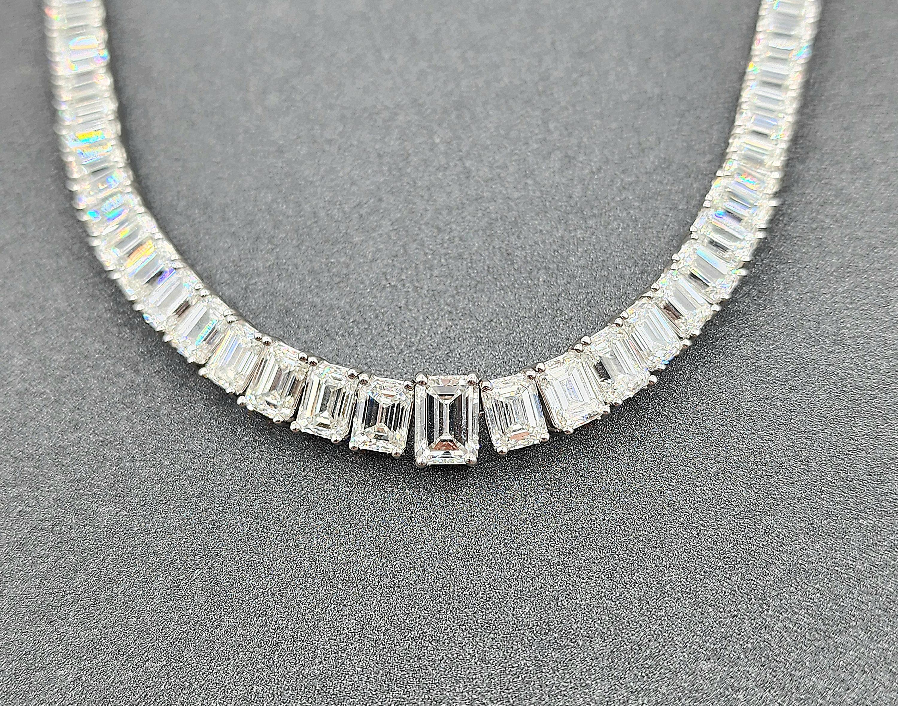 This exquisite diamond necklace captivates with its modern elegance. Featuring 31.38 carats of emerald-cut white diamonds, each stone is set in luxurious platinum. The largest 17 stones are GIA certified, available upon request. The diamonds are