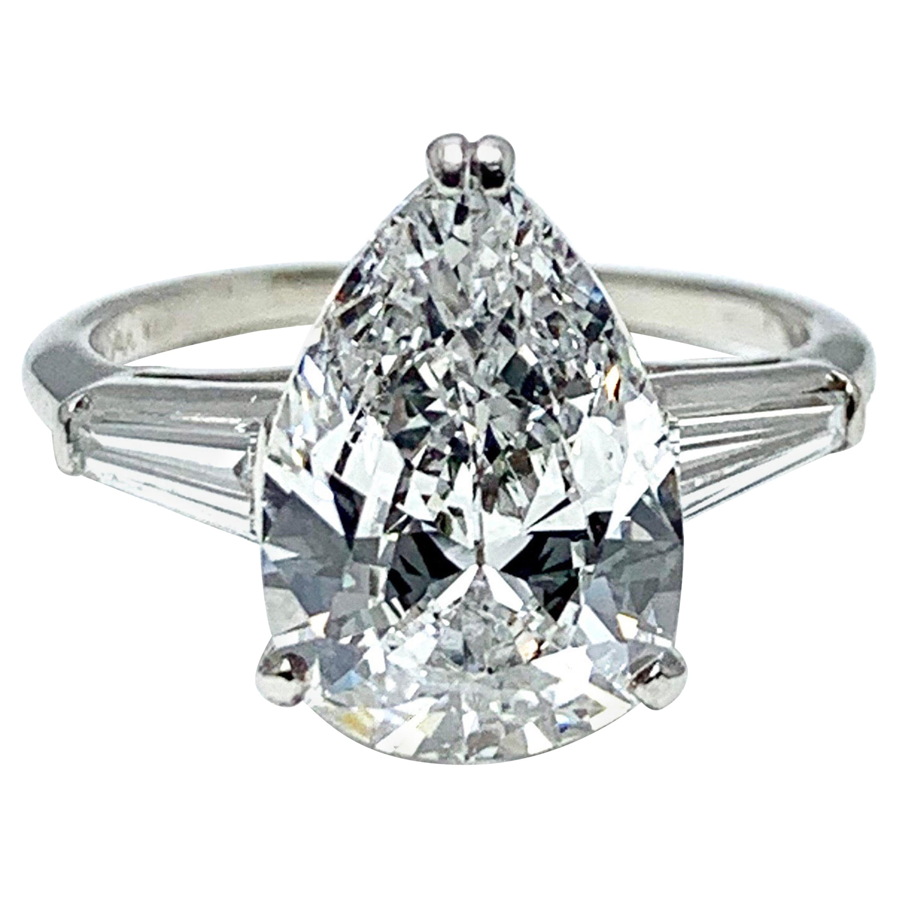 3.14 Carat D SI1 Pear Shape Diamond and Baguette Diamond Platinum Ring For Sale
