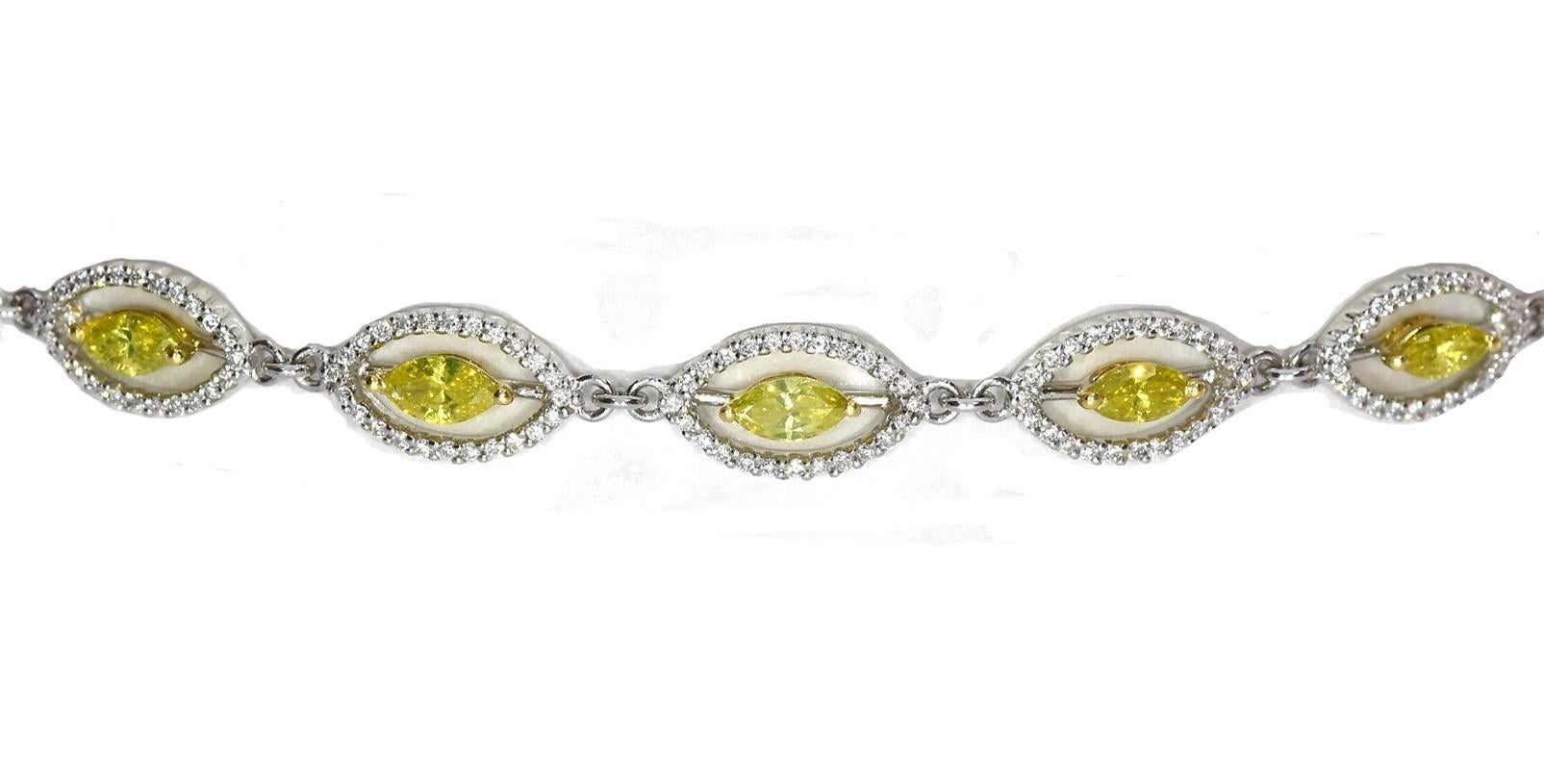 Bask in the luxuriousness of this 3.14 Carat Marquise Yellow Treated Diamond And White Diamond Bracelet. This beauty is adorned with 2.09 carat marquise cut yellow treated diamonds, in a total of 12 stones. The white diamonds set on this astonishing