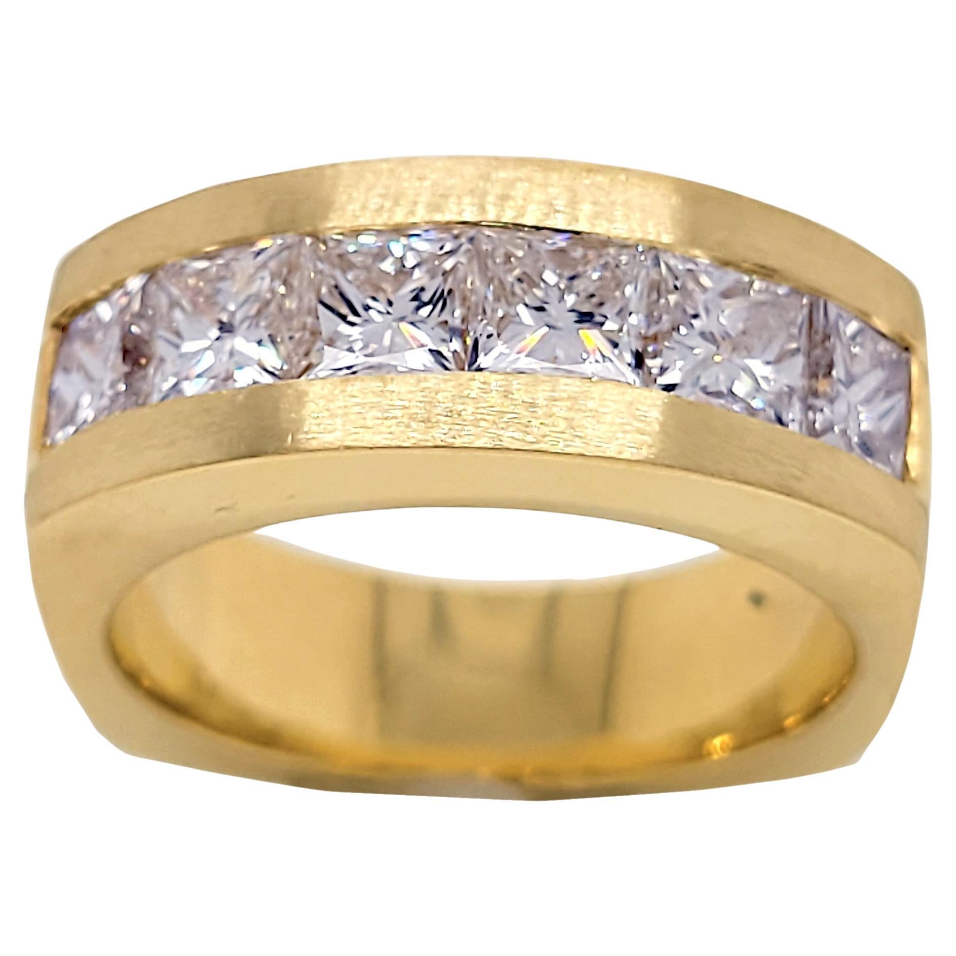 This Beautiful Gent's ring is made in 18K Yellow gold with shiny middle and matted sides. It has 6 pieces of perfectly matched princess cut diamonds (Total Weight 3.14 Ct - over 1/2 Ct each) channel set on the top. The ring is square shaped shank.