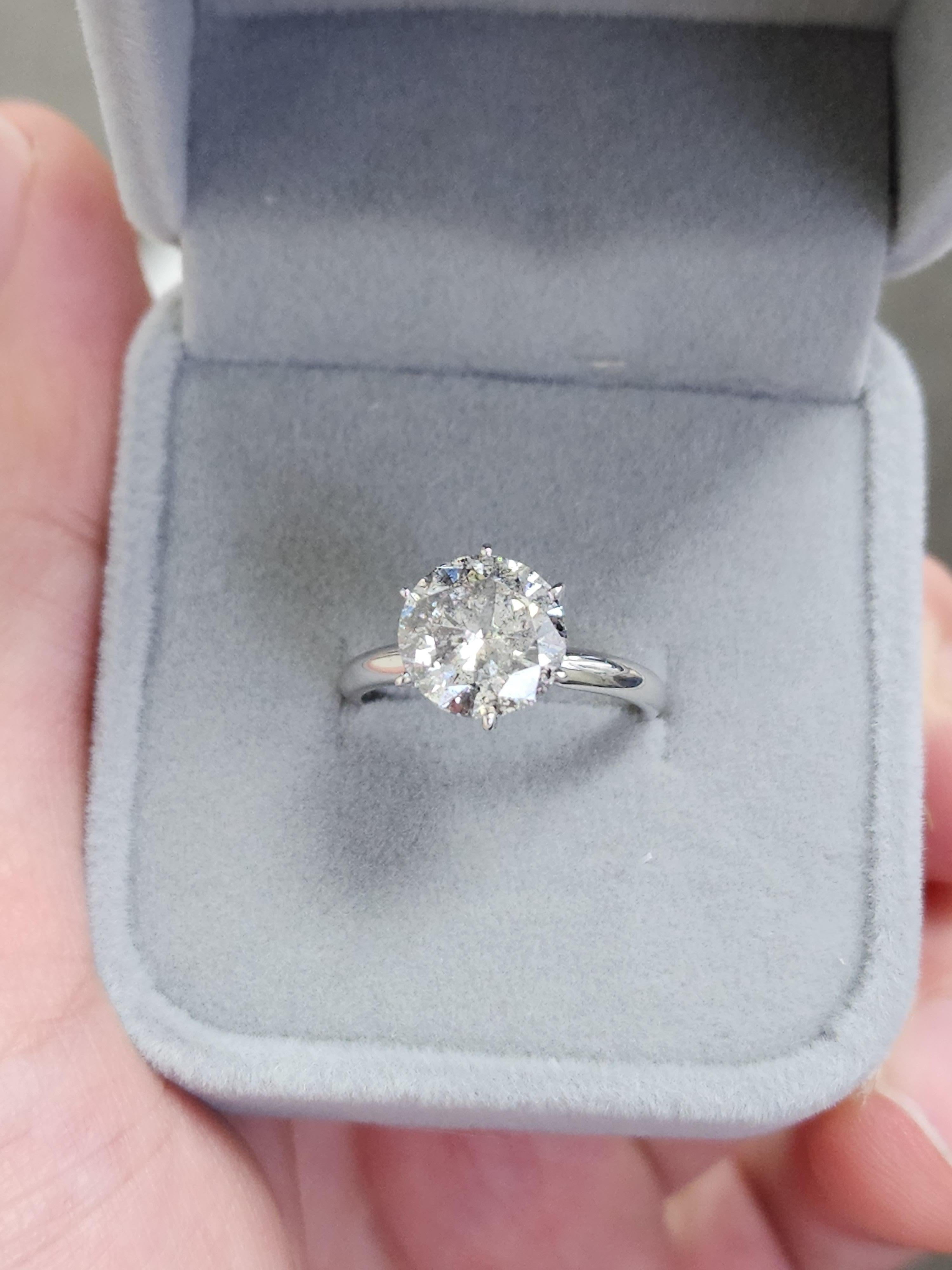 3.14 ct round brilliant cut natural diamonds. 6 prong solitaire setting, set in 14k white gold. Ring Size 6.5. 