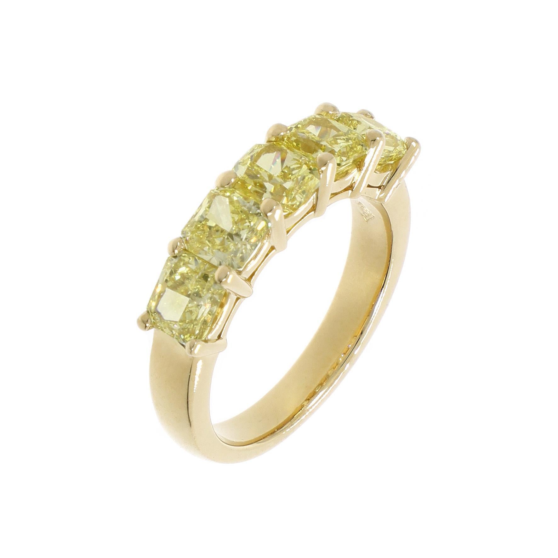 Set with 5 radiant-cut natural fancy yellow diamonds weighing a total of 3.14cts. Mounted in 18k yellow gold. Made in Switzerland.