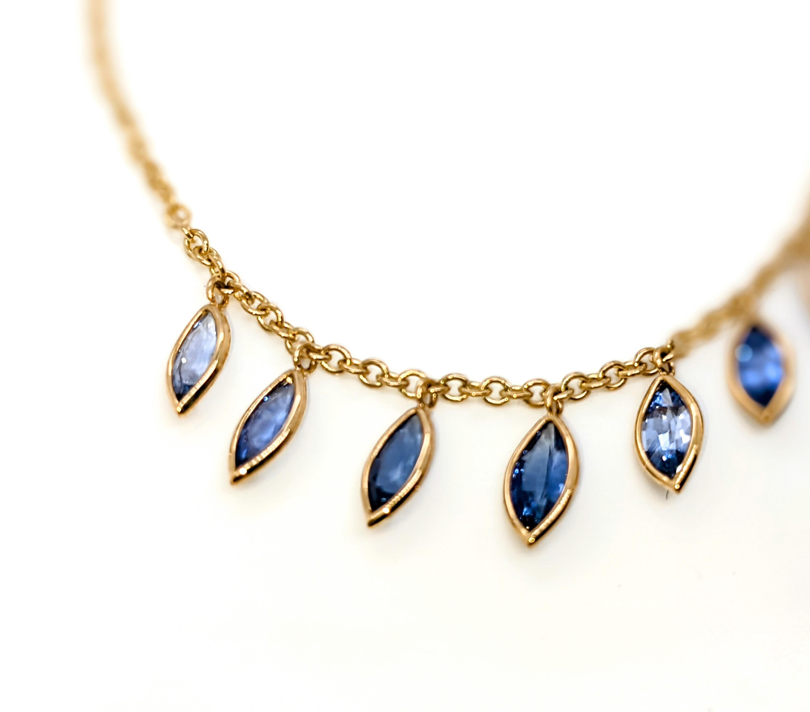 Elevate your style with this exquisite array, 3.14 carats of selected Ceylon blue Sapphires, marquise cut shape, 18k yellow gold necklace. Each sapphire is hand-selected for its brilliance and hue, creating a playful yet elegant cascade of gemstones