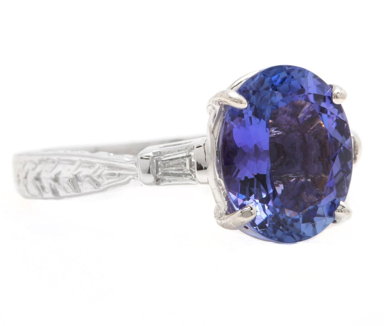 3.14 Carats Natural Very Nice Looking Tanzanite and Diamond 14K Solid White Gold Ring

Suggested Replacement Value:  $4,500.00

Total Natural Oval Cut Tanzanite Weight is: Approx. 3.00 Carats 

Tanzanite Measures: 1100 x 9.00mm

Natural Baguette