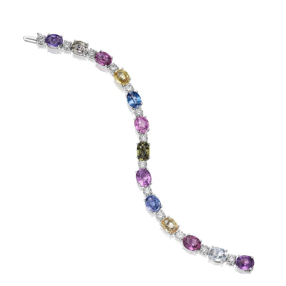 •	18KT White Gold
•	7” Long
•	31.46 Carats

•	Number of Oval Sapphires: 13
•	Carat Weight: 27.46ctw

•	Number of Round Diamonds: 13
•	Carat Weight: 4.00ctw

•	This bracelet contains a row of 13 beautiful multi colored oval sapphires in shades pink,